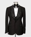 Black tuxedo jacket with jeweled sequin trim and matching satin bow tie, white shirt