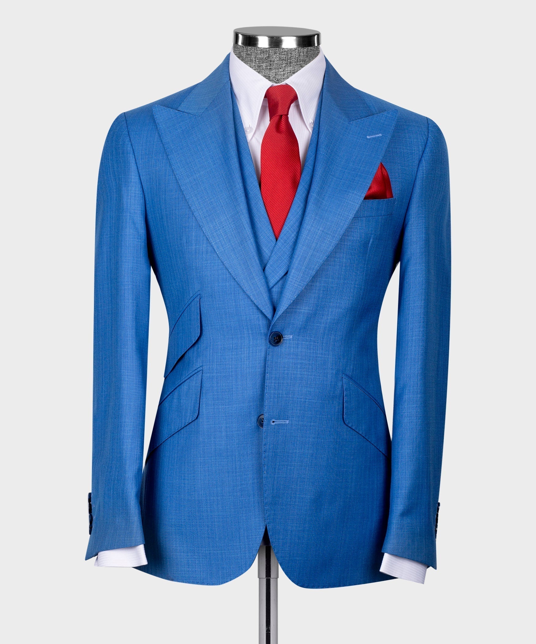Blue suit jacket and vest set with white shirt, red tie, and red pocket square