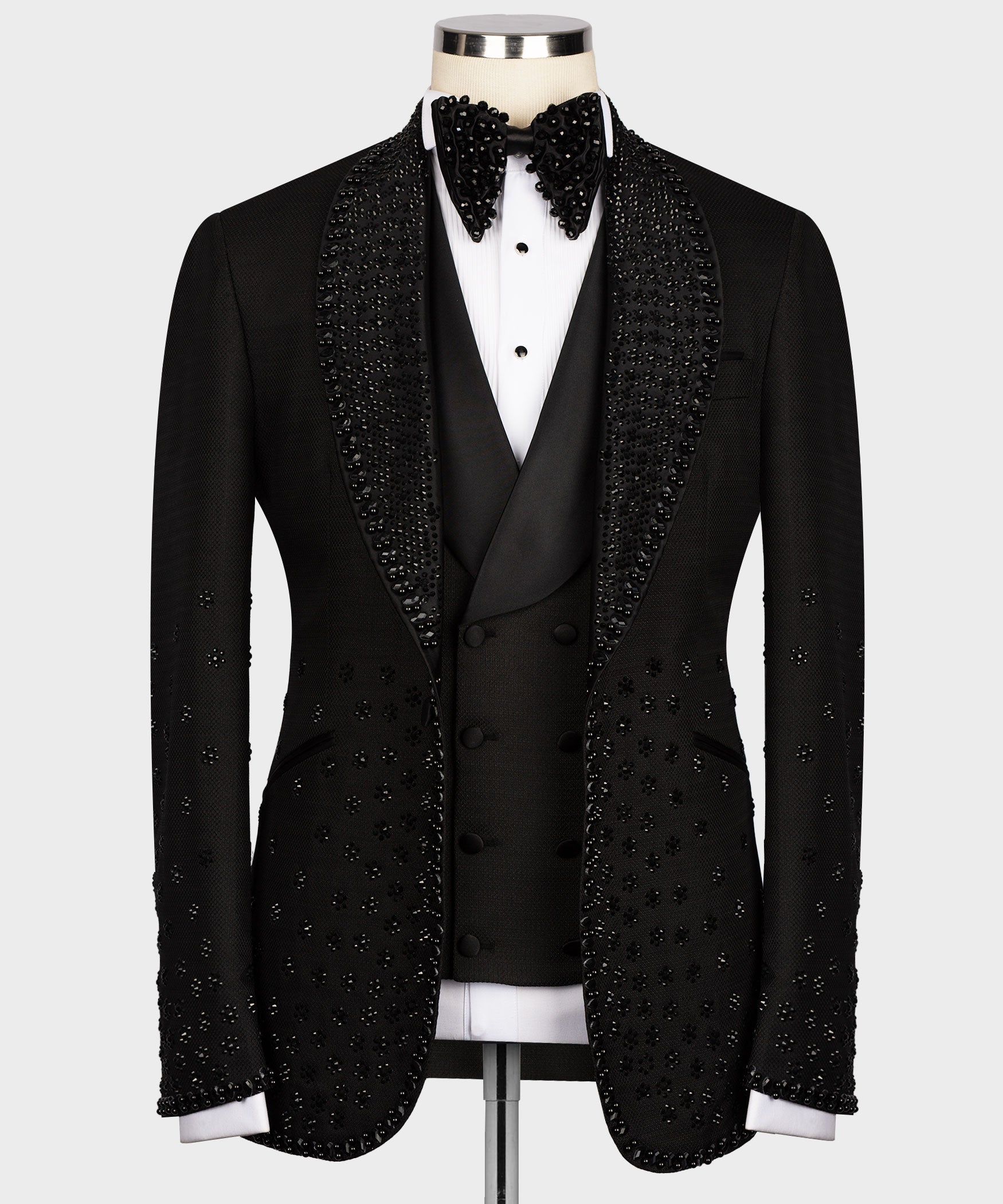 Black tuxedo jacket with double-breasted vest, jeweled trim, bow tie, white shirt