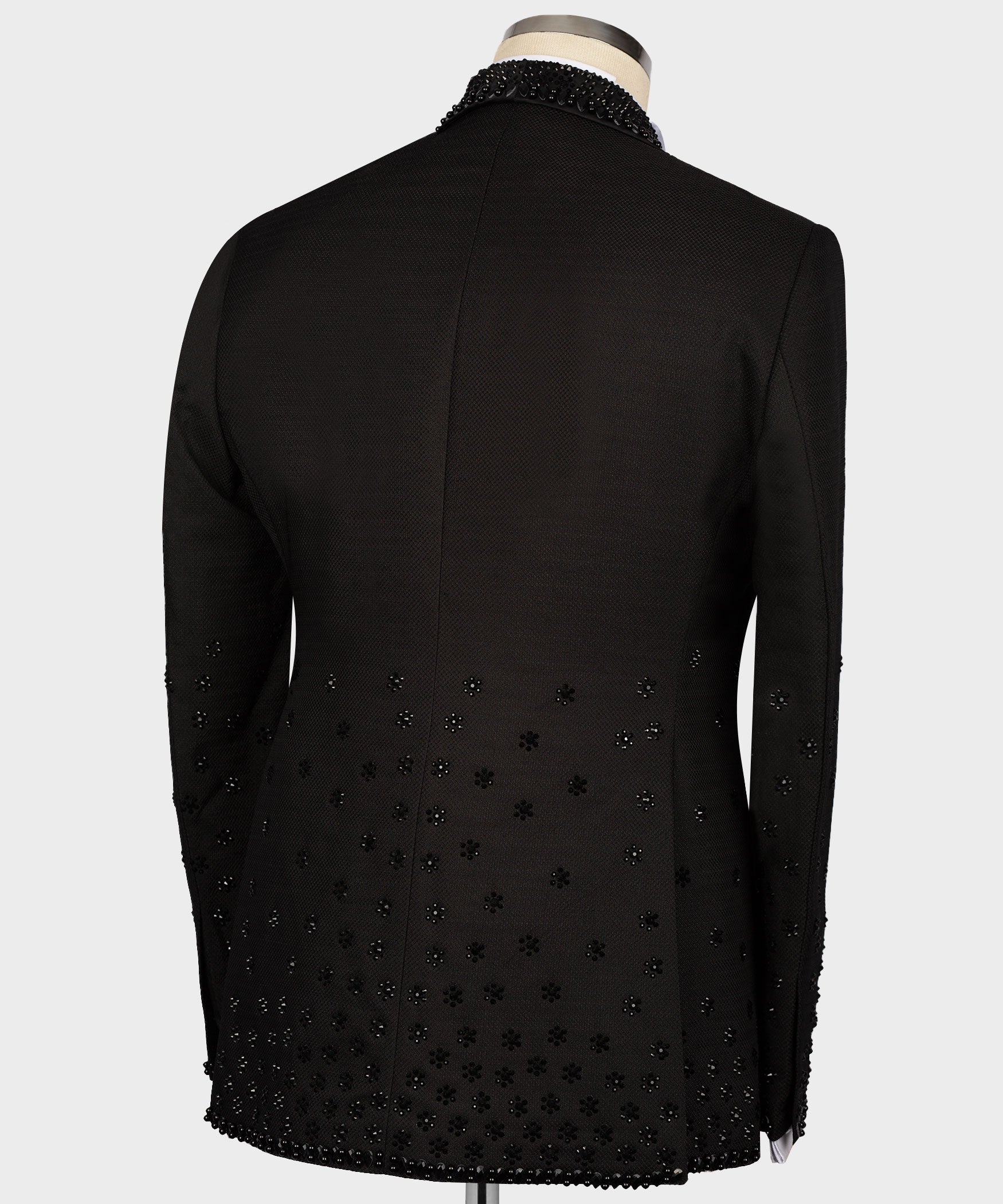 Black tuxedo jacket back with scattered rhinestone pattern and center seam