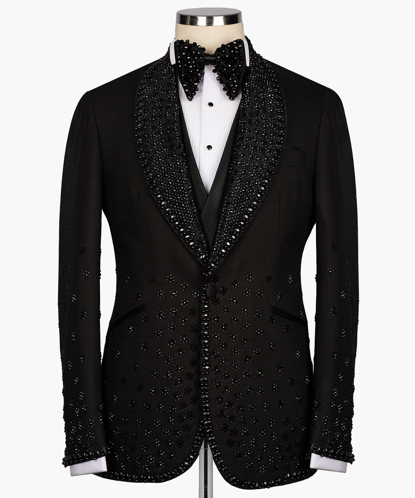 Black tuxedo jacket with jeweled sequin trim, satin lapels, and bow tie detail