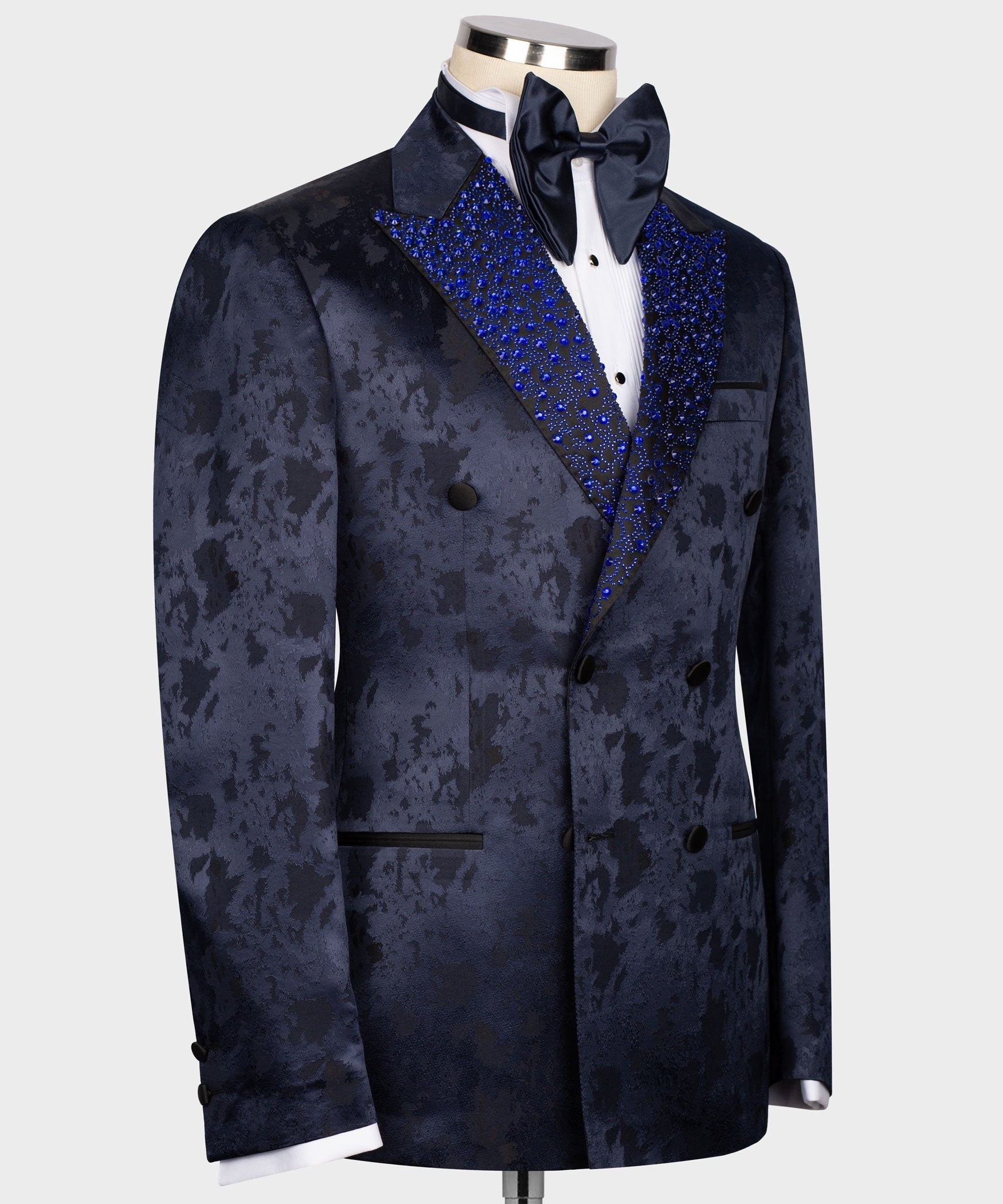 Navy tuxedo jacket, double-breasted front, blue sequin peak lapel and welt pockets
