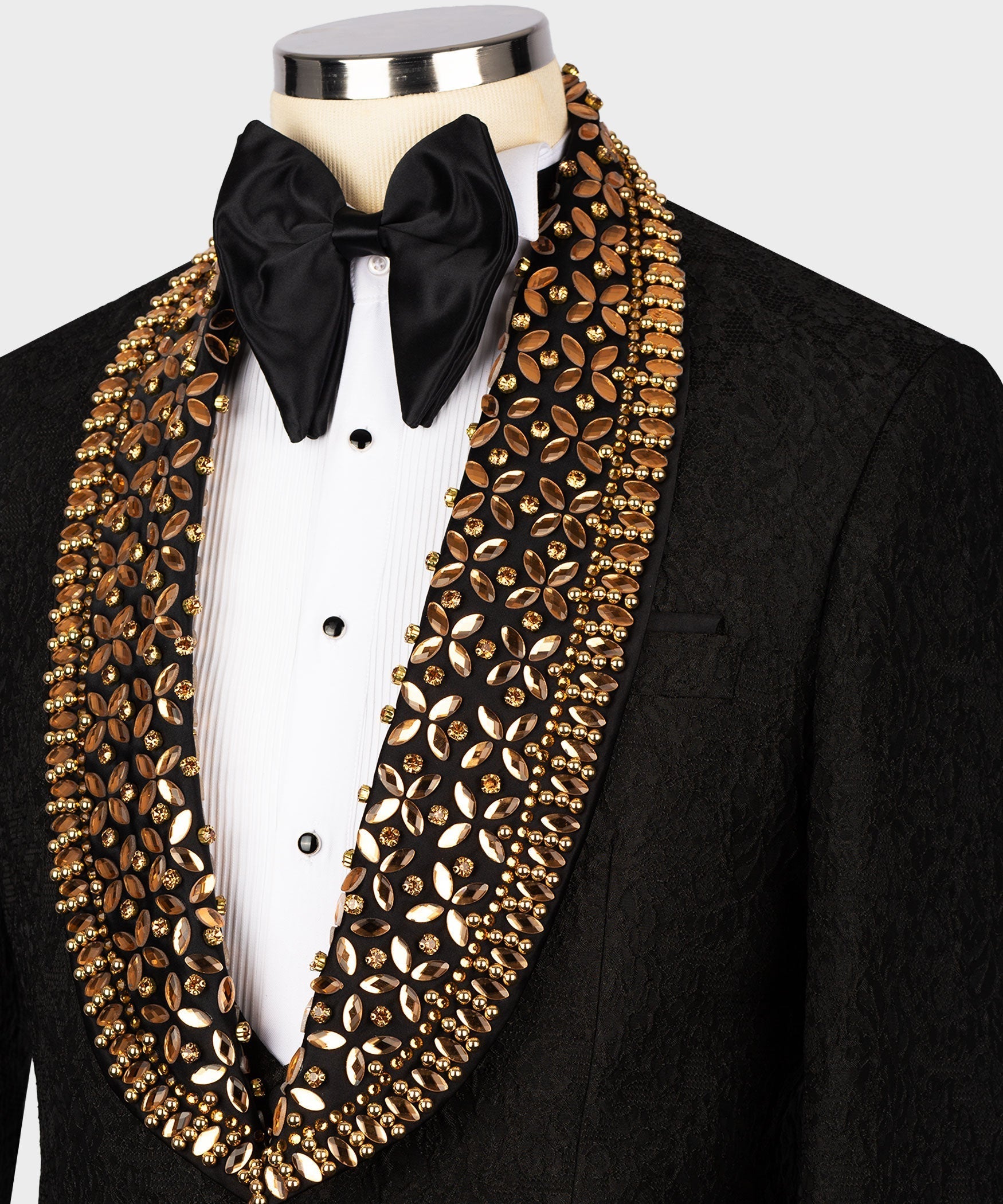 Black tuxedo with gold embellished shawl lapel and black satin bow tie