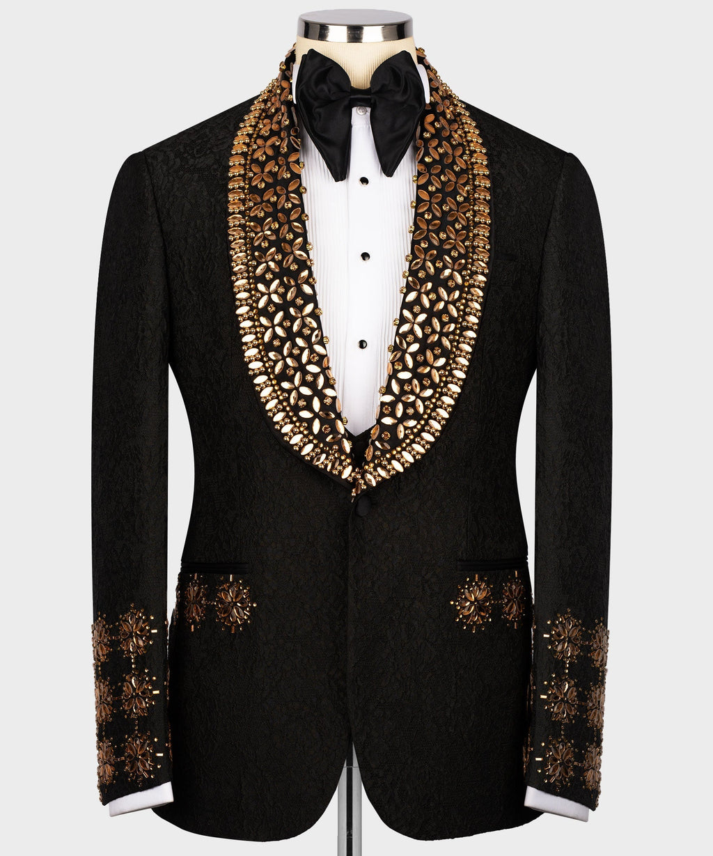 Black tuxedo jacket with gold gem-like embroidered lapels and jeweled trim at cuffs