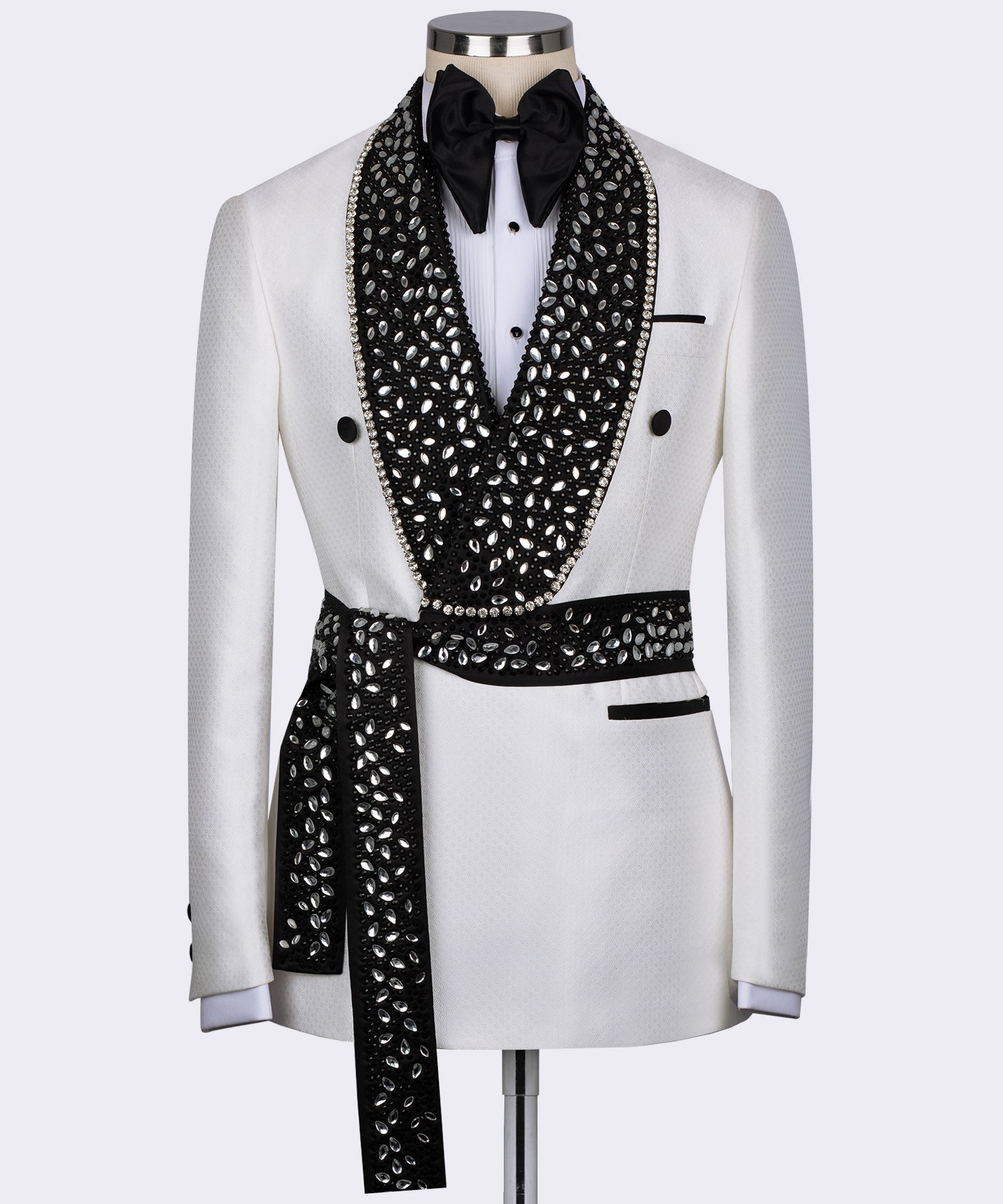 White tuxedo jacket with black jeweled lapels, bow tie, satin trim, and buttons