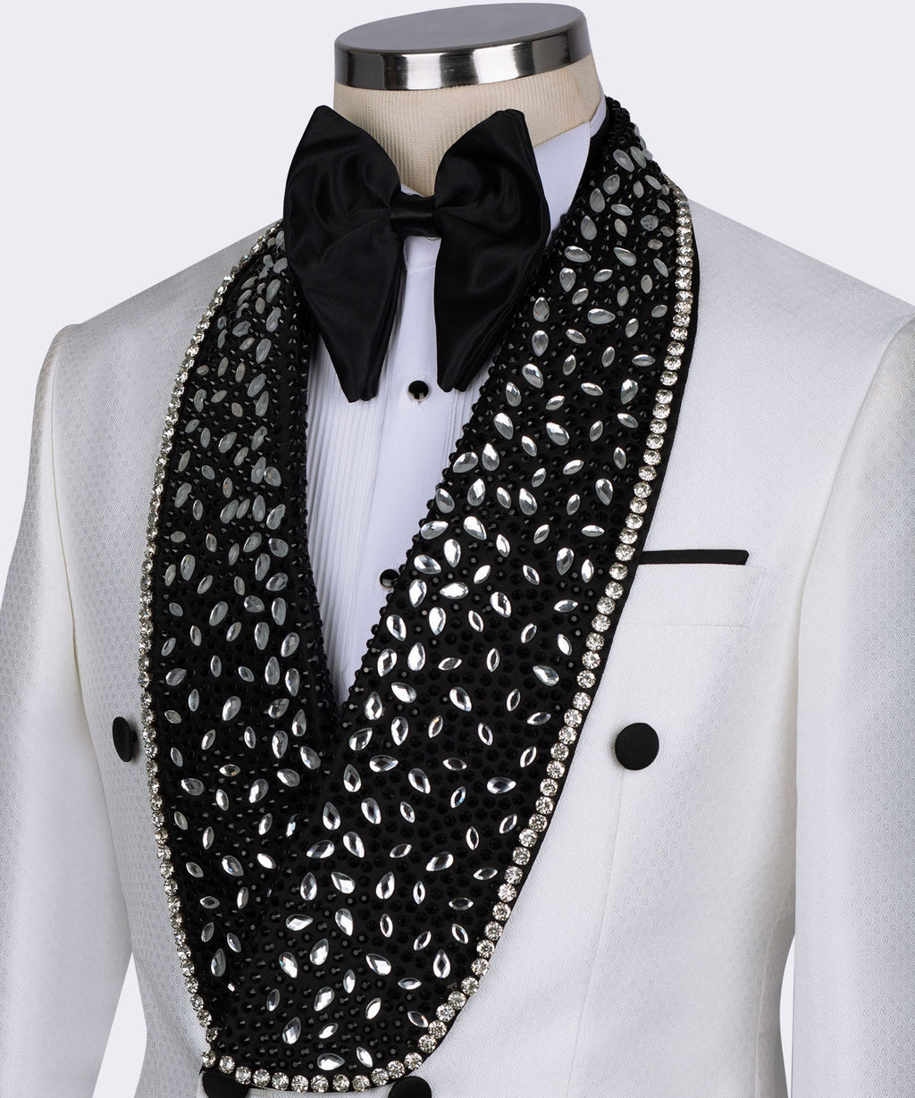 Close-up: white tuxedo collar with black gem lapel, rhinestone trim, and black bow tie