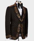Black tuxedo suit with gold beadwork accents and satin bow tie on the lapel