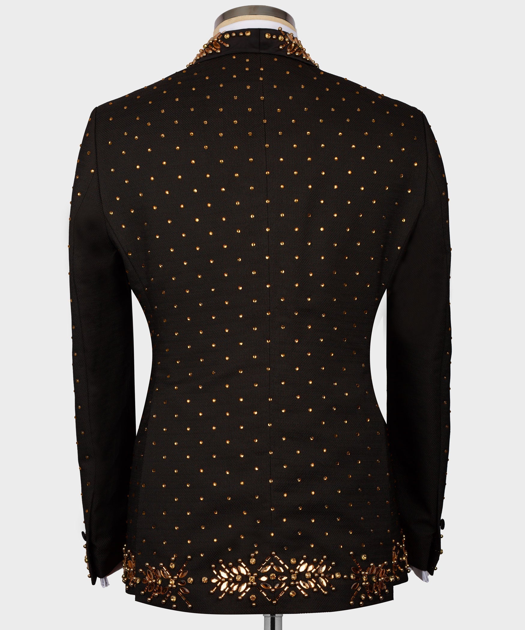 Black tuxedo jacket back with gold beaded dots and embellished hem trim