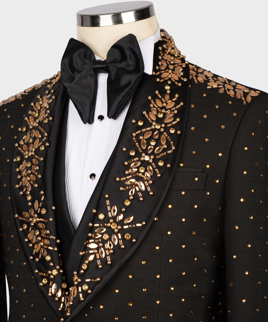 Black tuxedo jacket with gold beaded patterns, pocket details, and satin bow tie