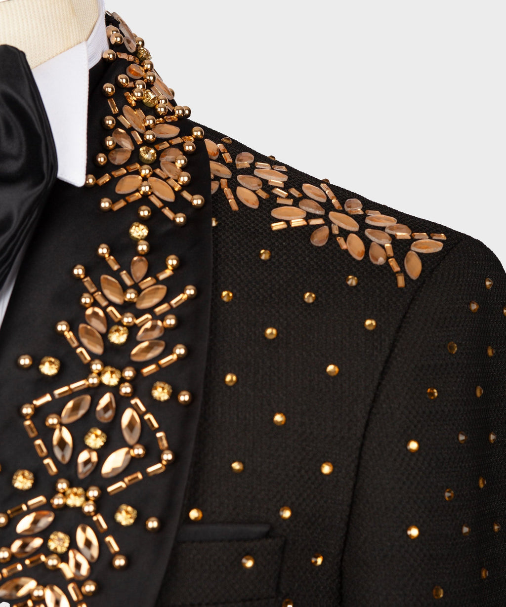 Black tuxedo lapel with gold floral beadwork and bronze-toned sequin details