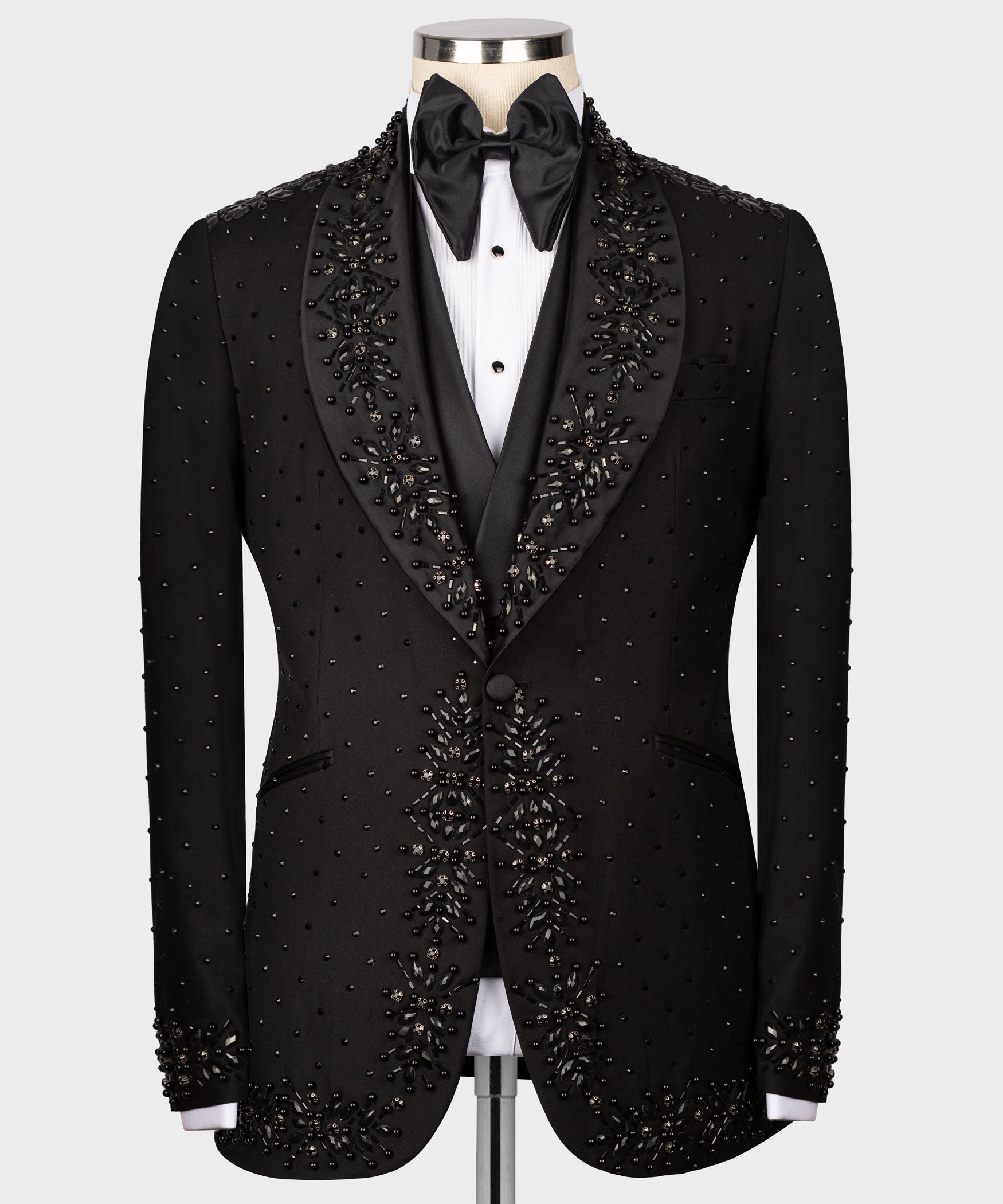 Black tuxedo jacket with embellished trim and satin bow tie at neckline