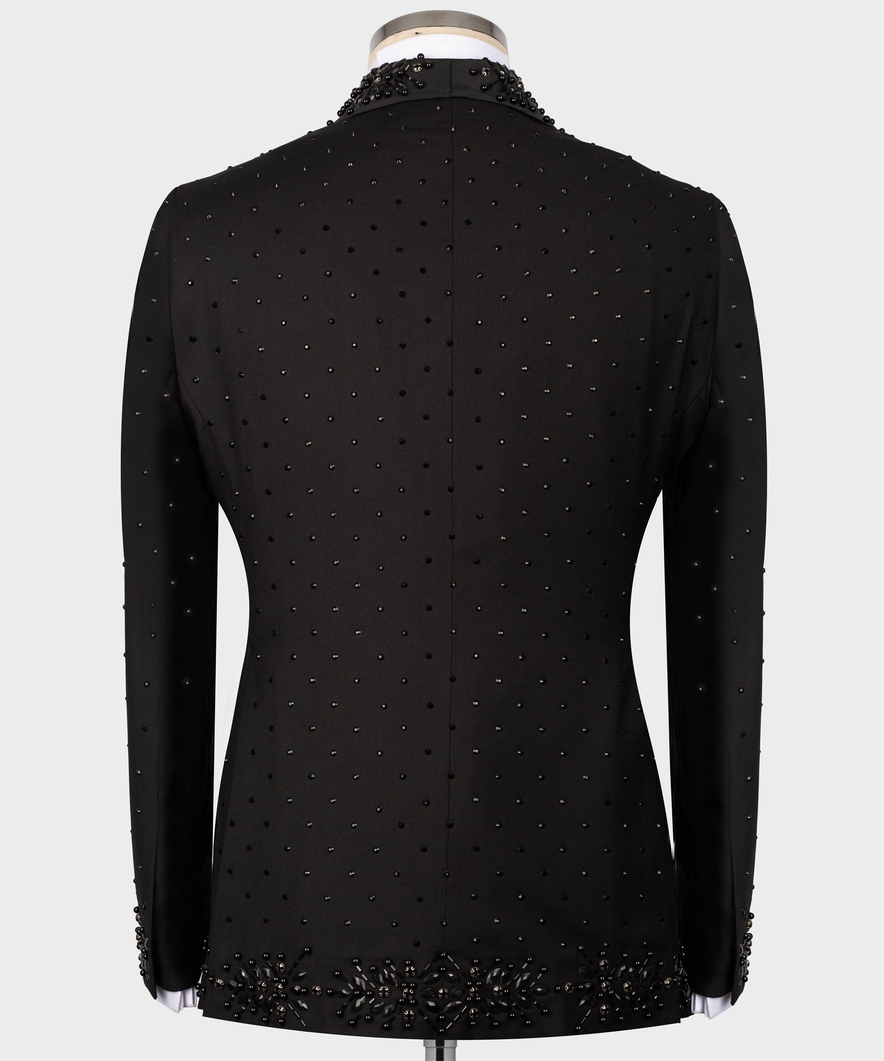 Black tuxedo jacket back view with scattered bead details and vented hem