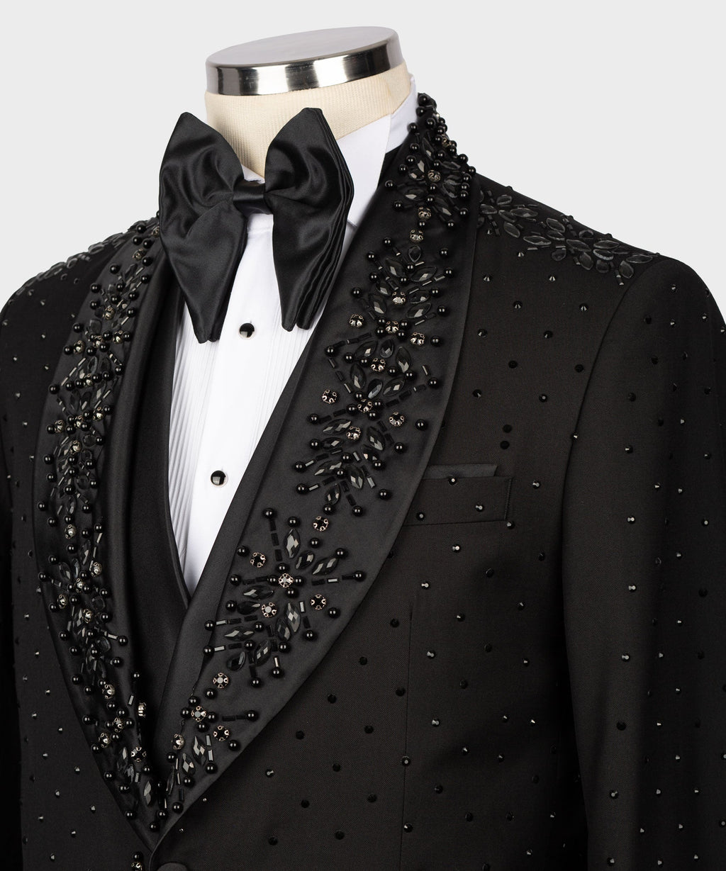 Black tuxedo jacket with satin bow tie and dazzling beadwork on vest front