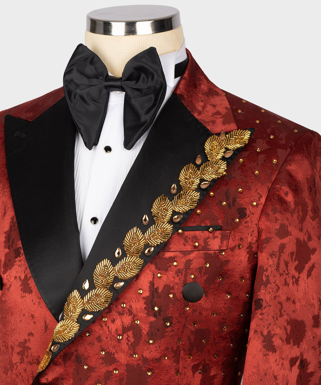 Red patterned tuxedo jacket close-up with gold embroidered diagonal trim and black lapels