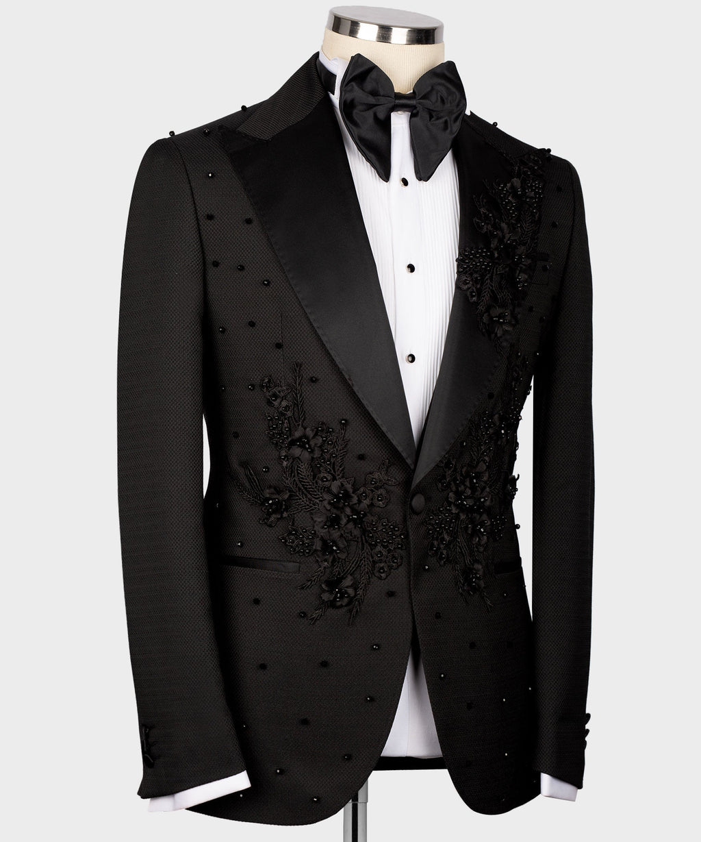 Black tuxedo jacket with floral embroidery on lapels and chest, satin bow tie