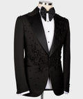Black tuxedo jacket with floral embroidery on lapels and chest, satin bow tie