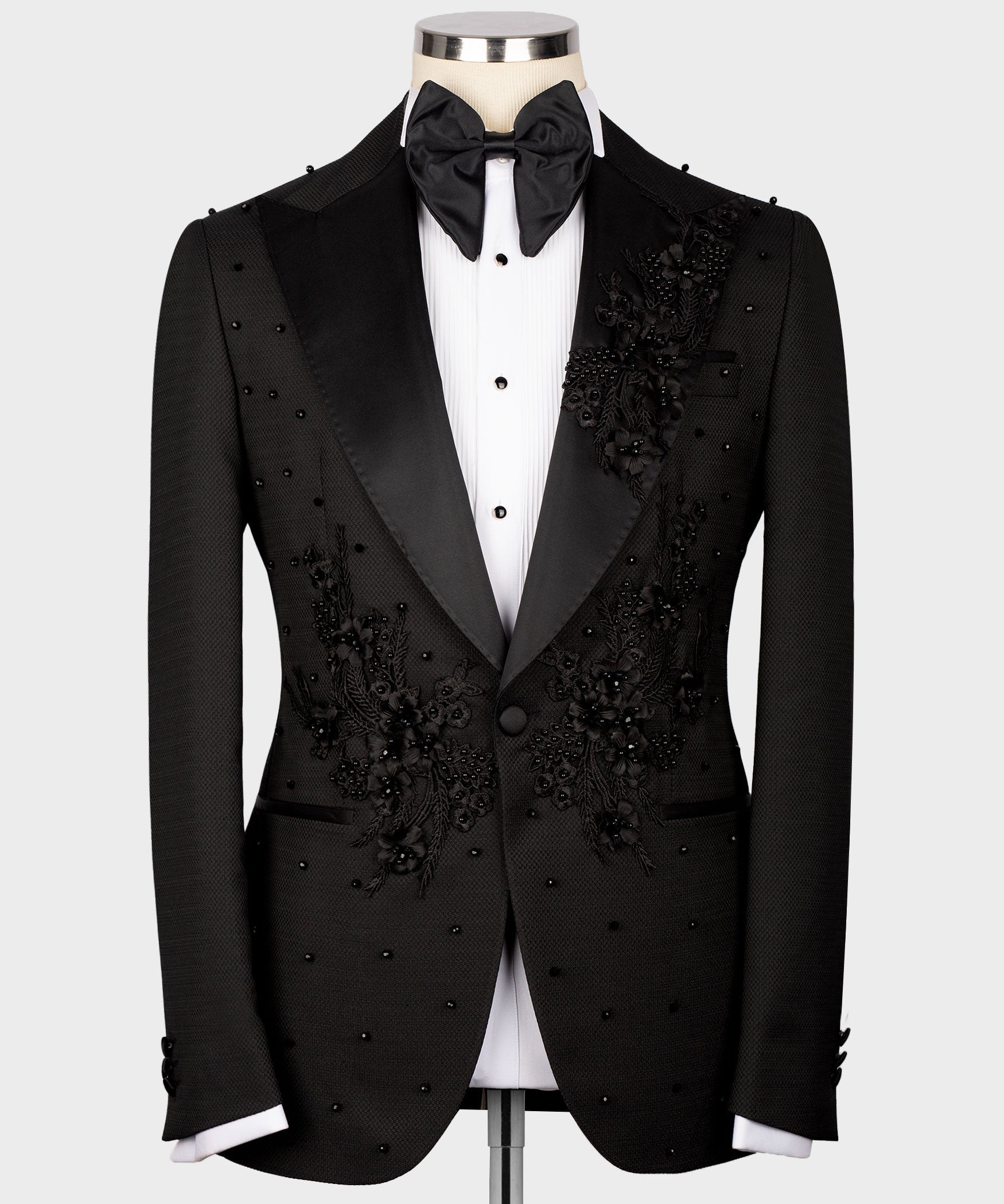Black tuxedo set with bow tie, vest, and jacket featuring scattered dot studs