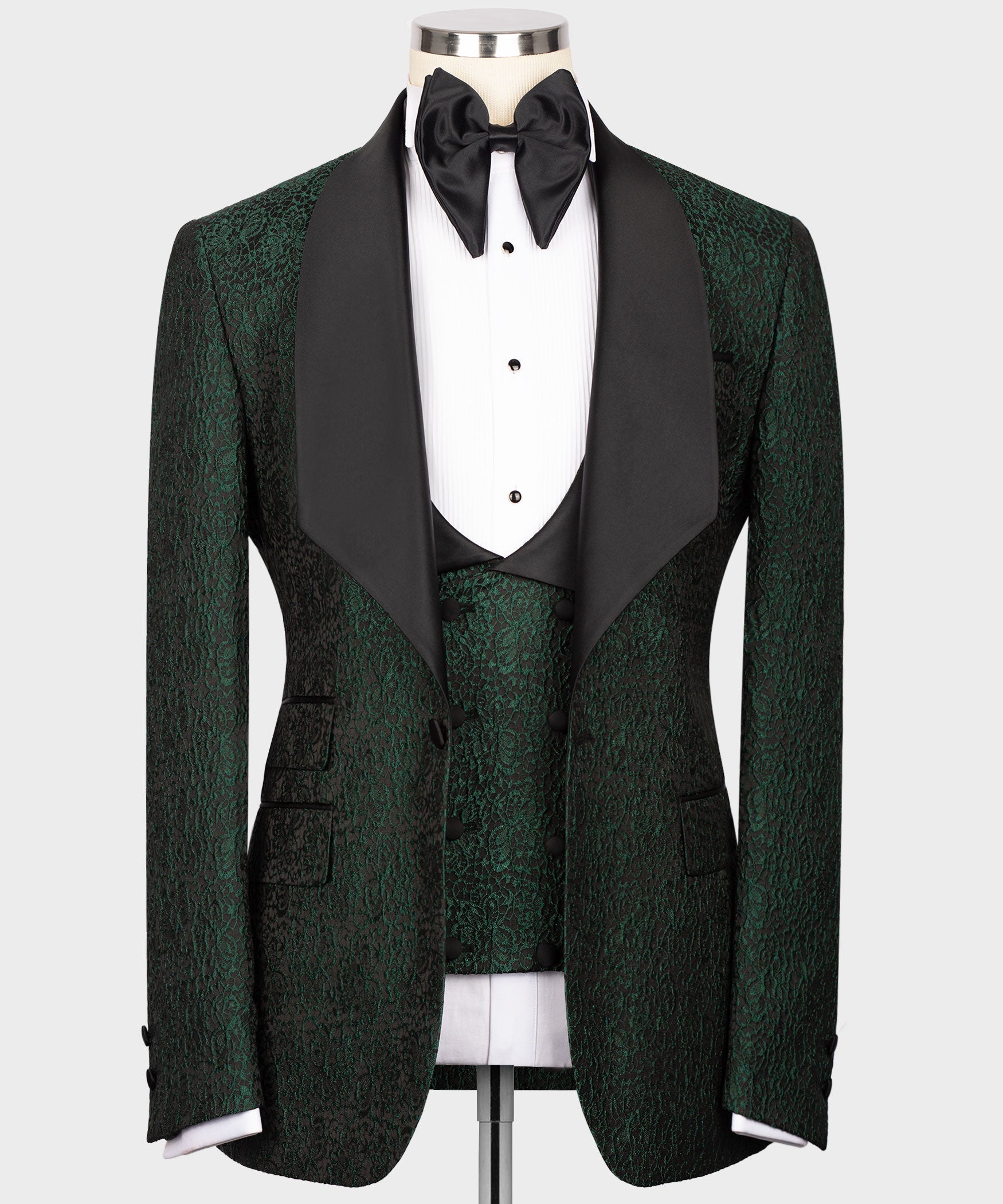 Green embossed tuxedo suit with black satin lapels, bow tie and waistcoat