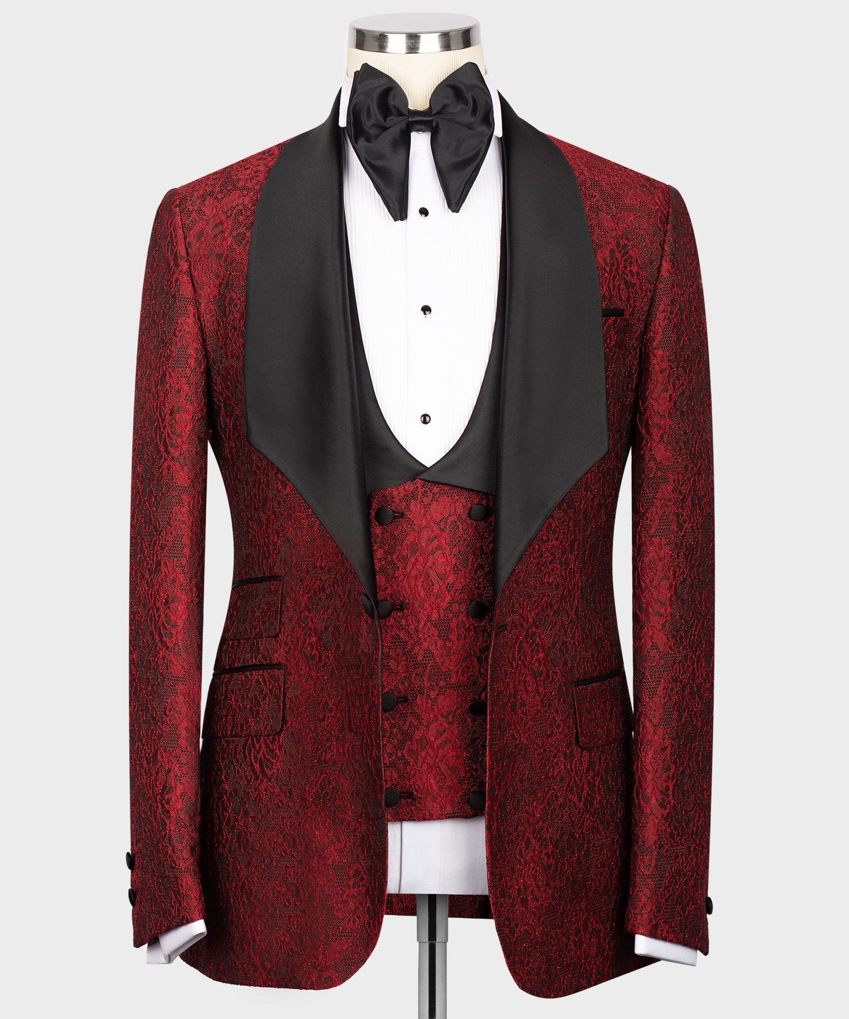 Men's red embossed tuxedo jacket with black satin lapels and matching vest