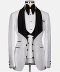 White and black embossed tuxedo jacket with satin black lapels and bow tie