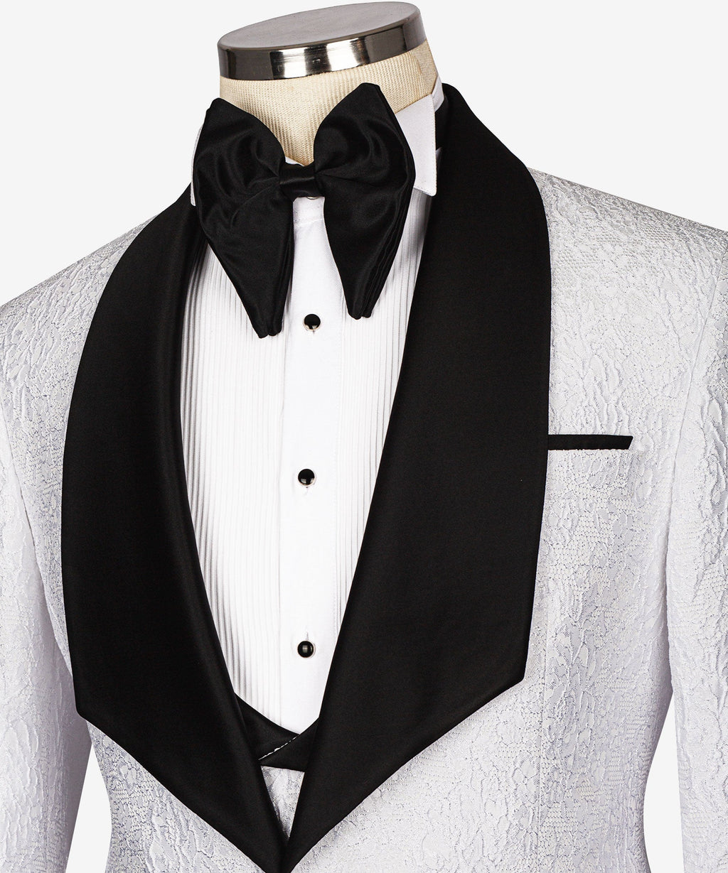 Embossed tuxedo shirt and vest details with black satin bow tie and lapels
