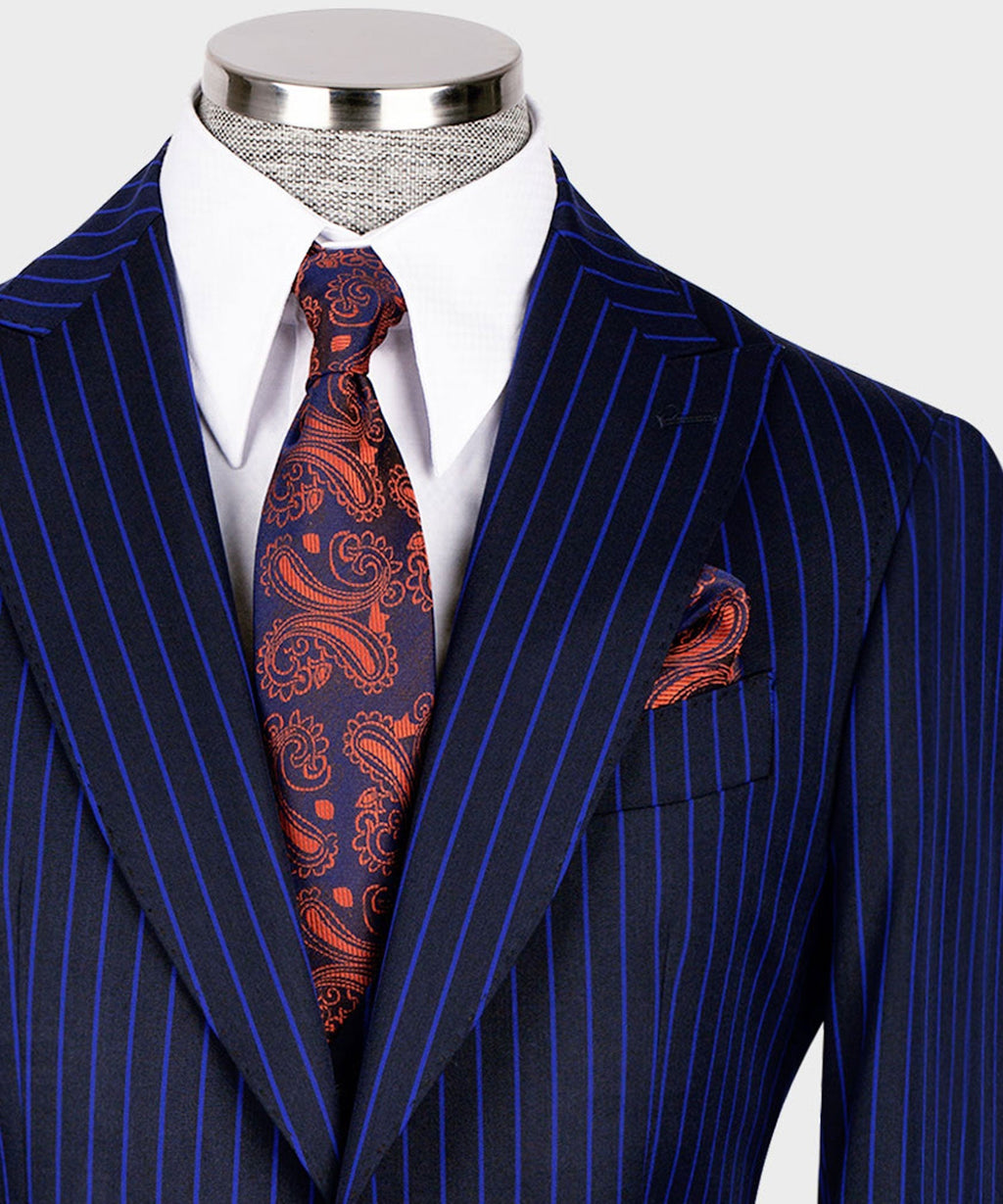 Close-up navy pinstripe lapel with paisley-pattern tie and matching pocket square