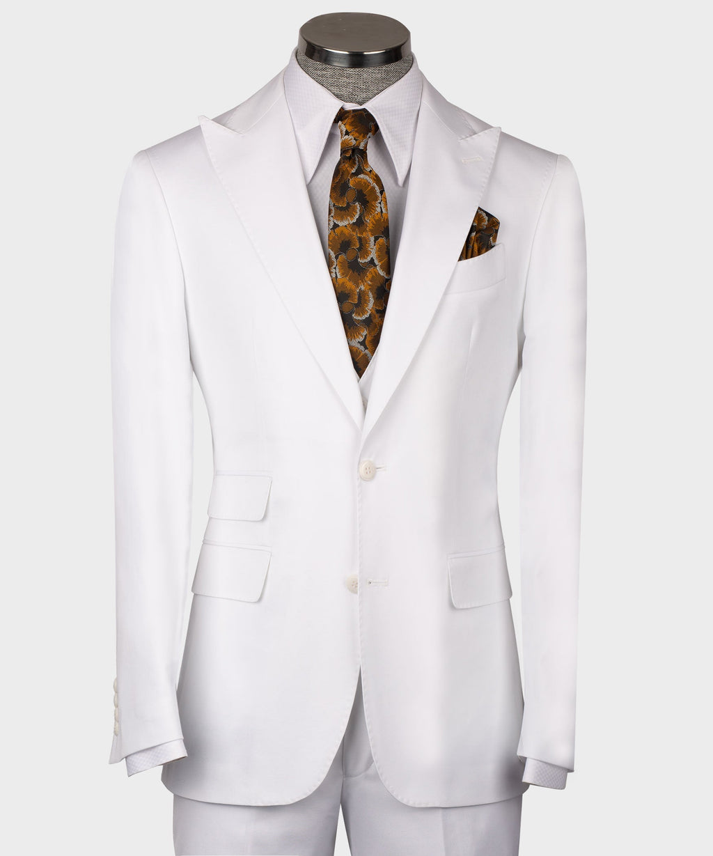 White formal men’s waistcoat on mannequin with button front and welt pockets; patterned tie