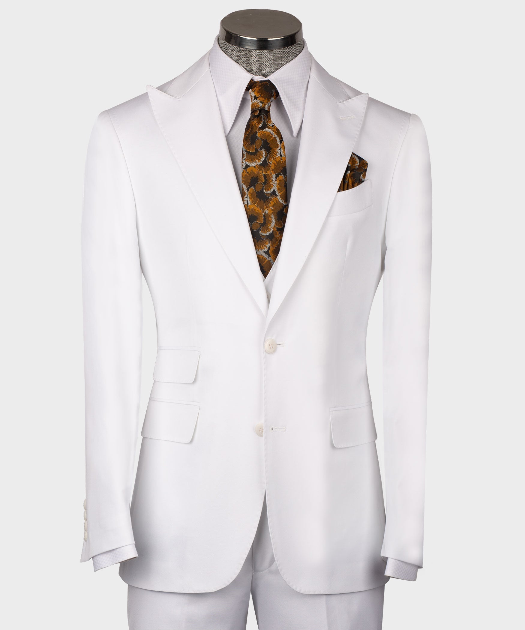 White formal men’s waistcoat on mannequin with button front and welt pockets; patterned tie