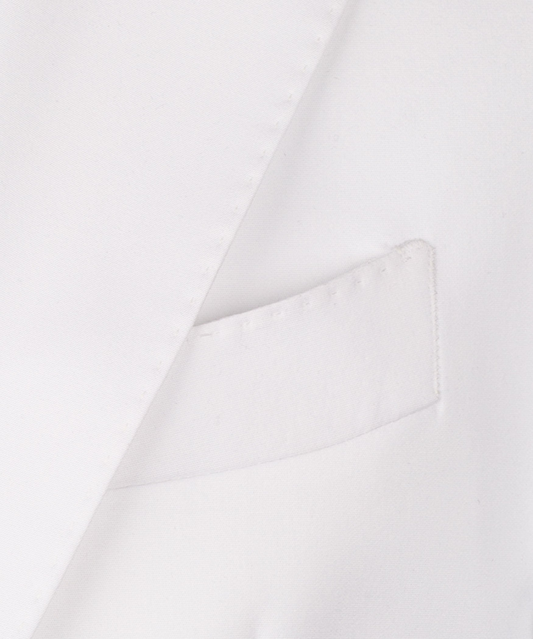 Close-up: white waistcoat front pocket and fabric texture detail