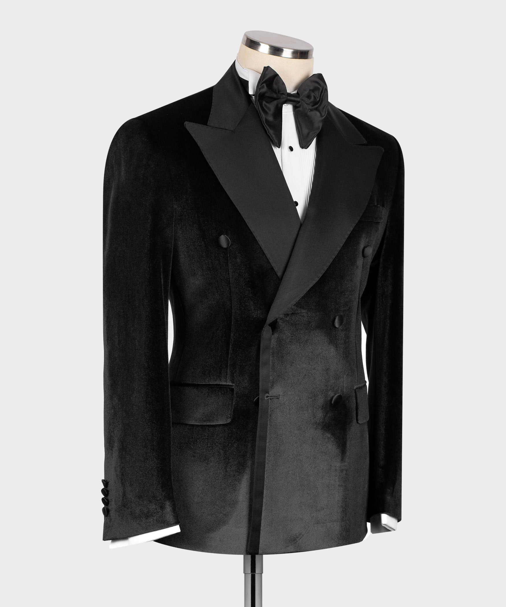Black velvet double-breasted tuxedo jacket with satin lapels and flap pockets