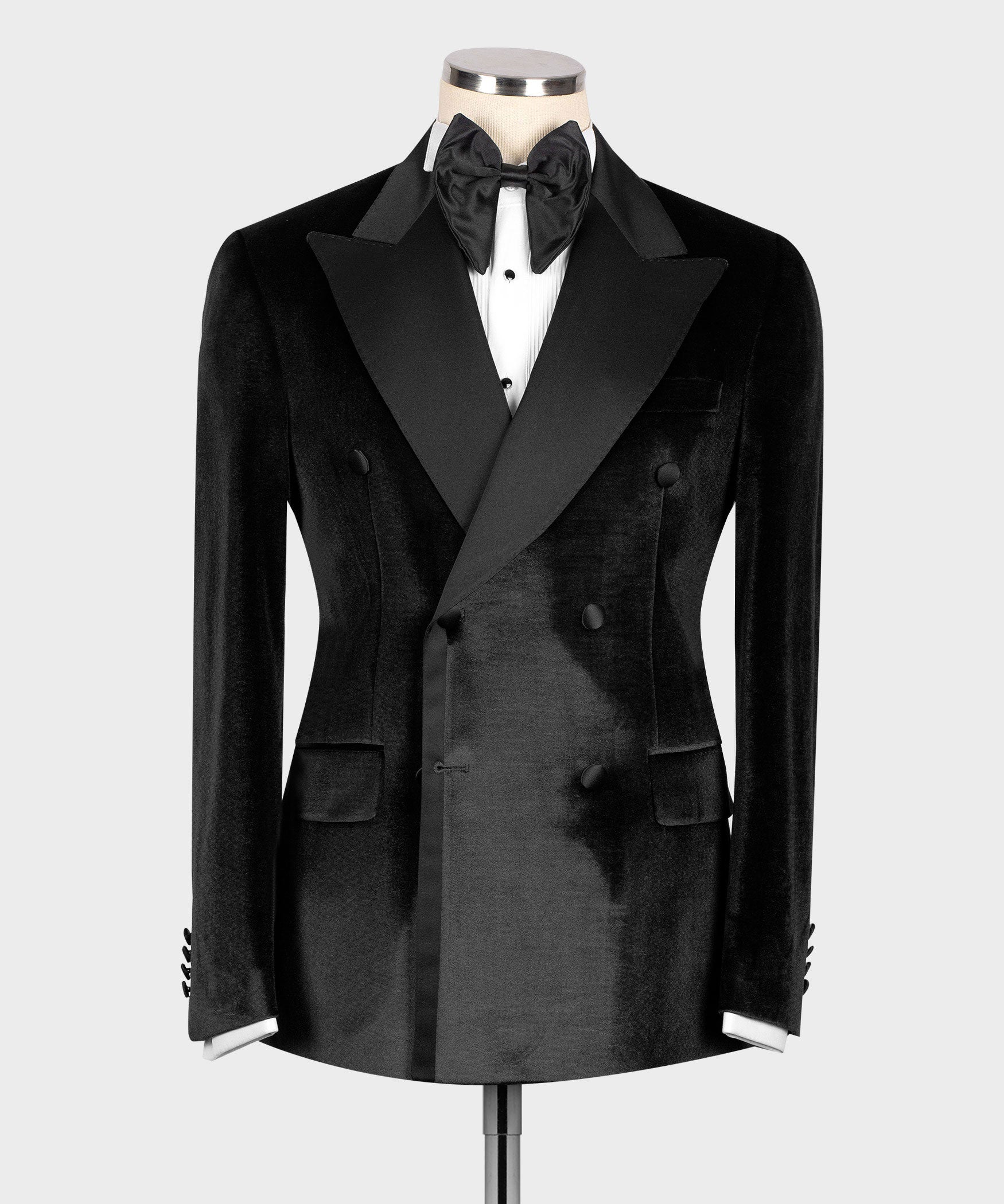Black velvet tuxedo jacket with satin peak lapels, double-breasted front, bow tie