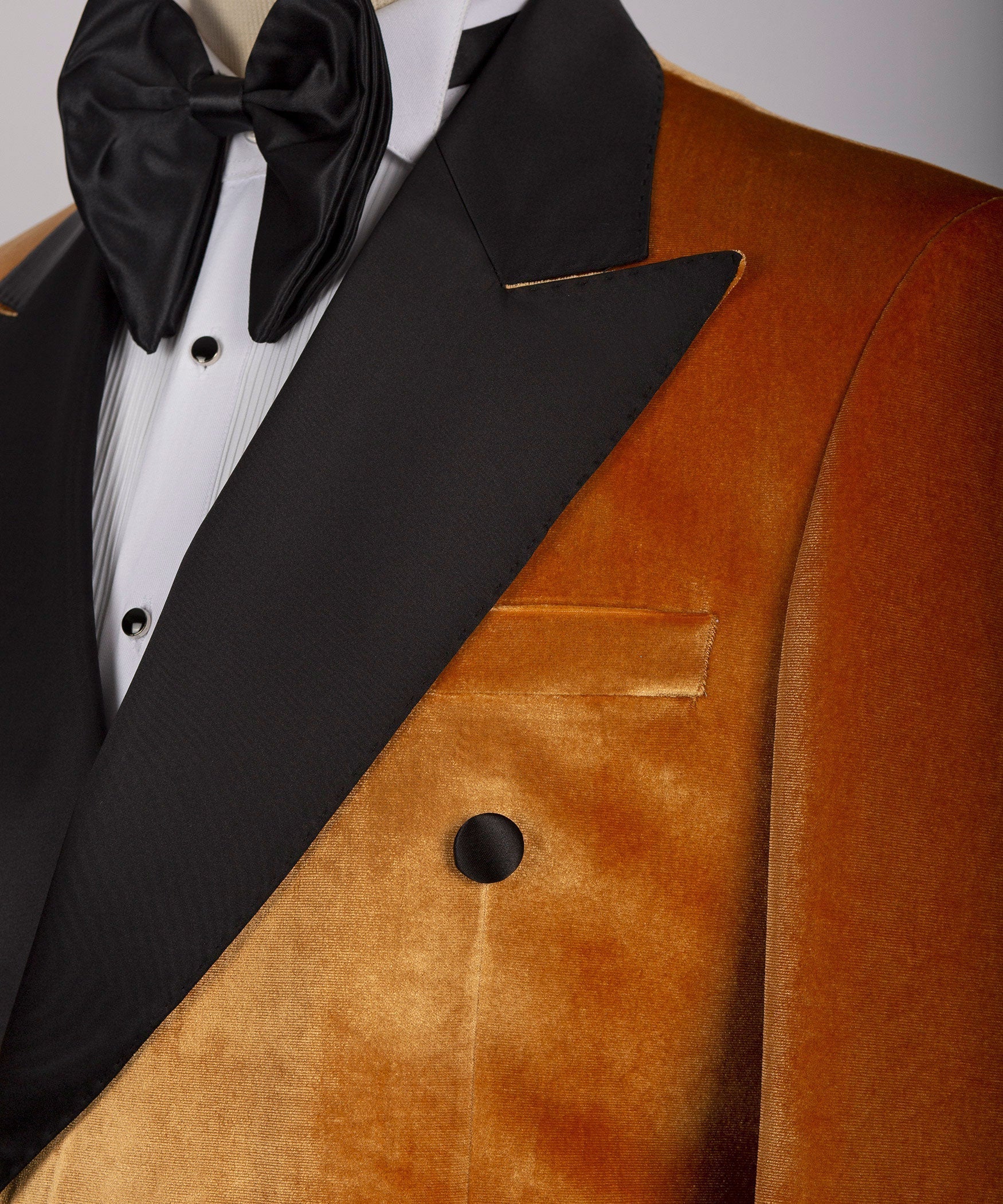 Black satin lapel and chest pocket on yellow velvet double-breasted tuxedo jacket