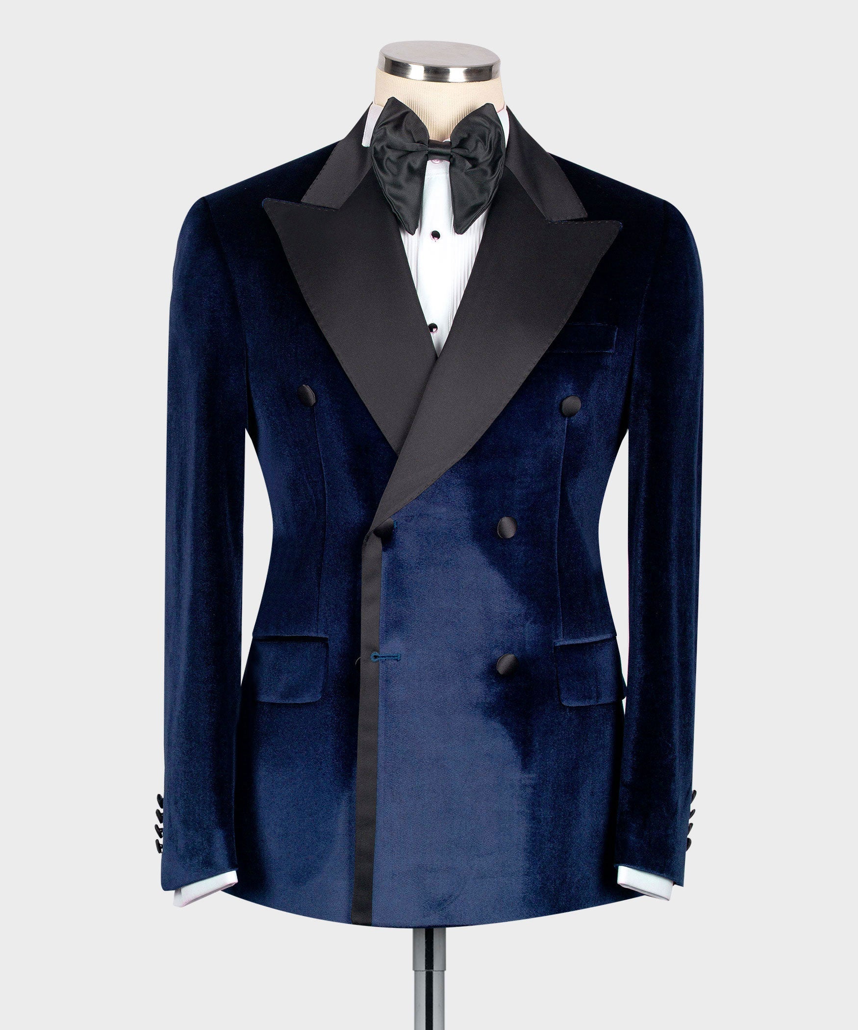 Blue velvet double-breasted tuxedo jacket with black satin lapels and bow tie