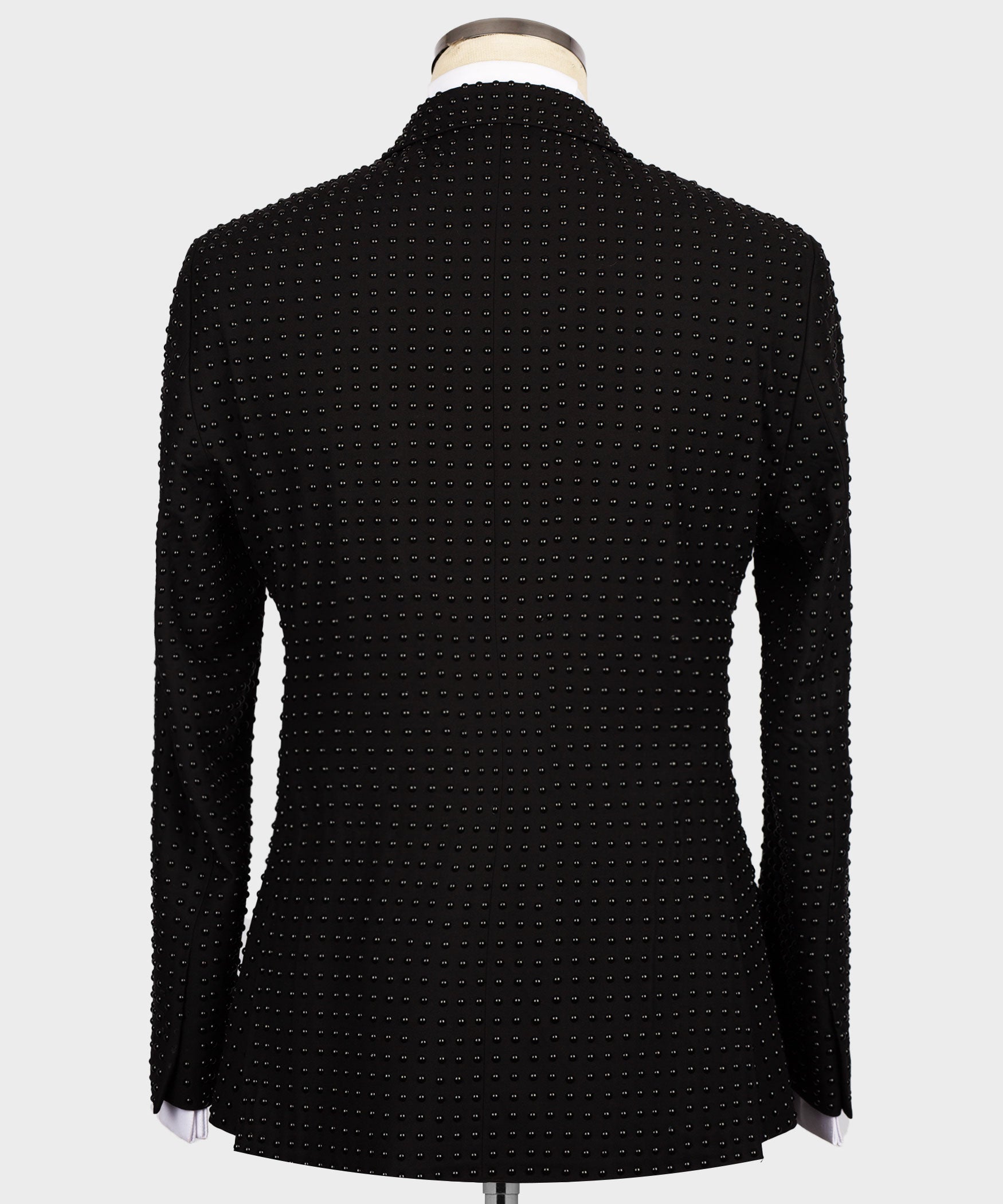 Back view of black tuxedo jacket with all-over stone-embellished pattern
