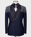 Blue tuxedo with floral stone embroidery on lapels and satin bow tie