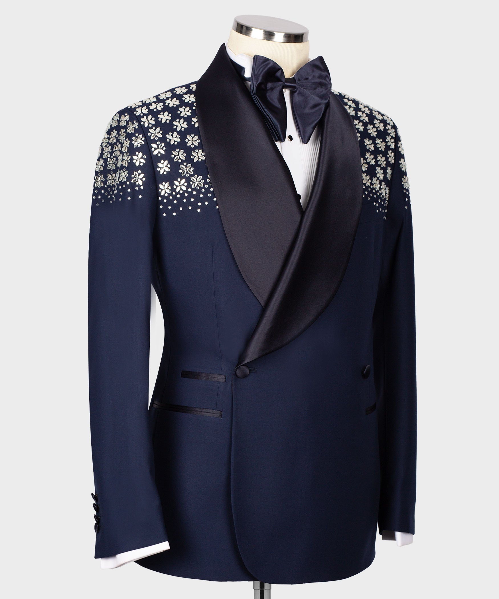 Navy-blue tuxedo jacket, buttoned front, floral stone embroidery on shoulders