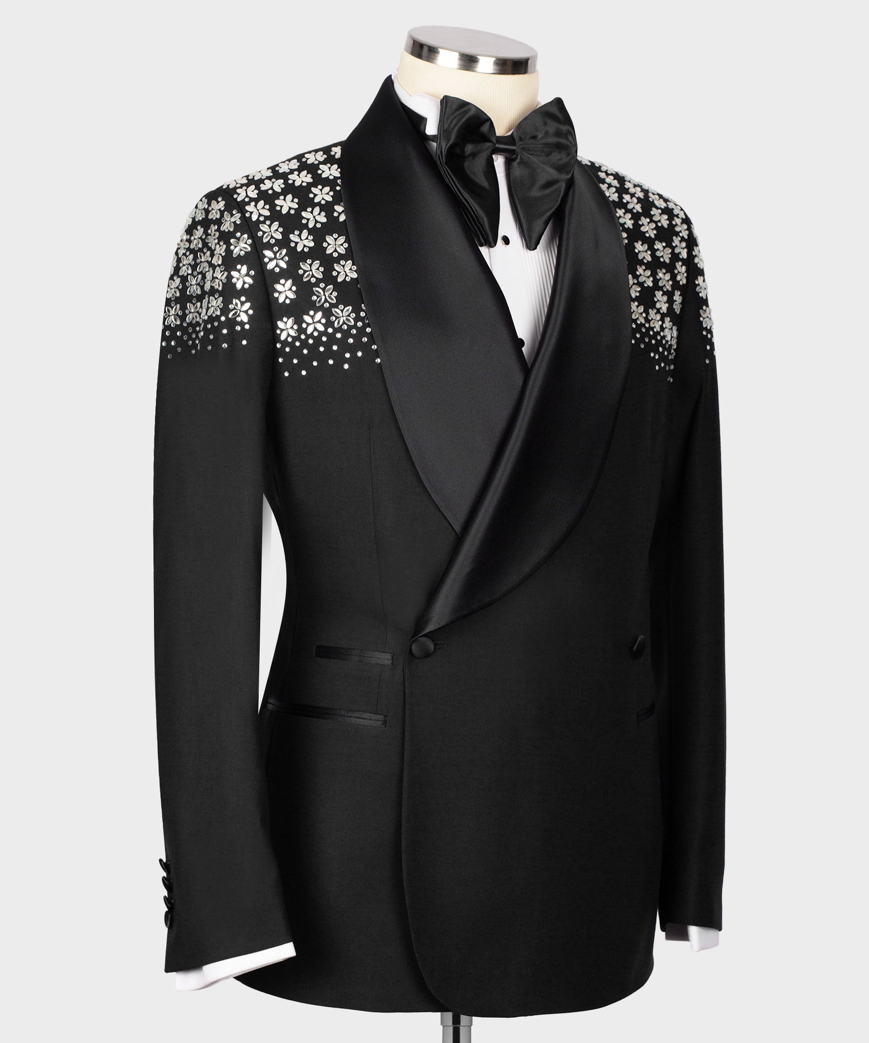 Men's black tuxedo jacket, satin bow tie and embroidered front panel