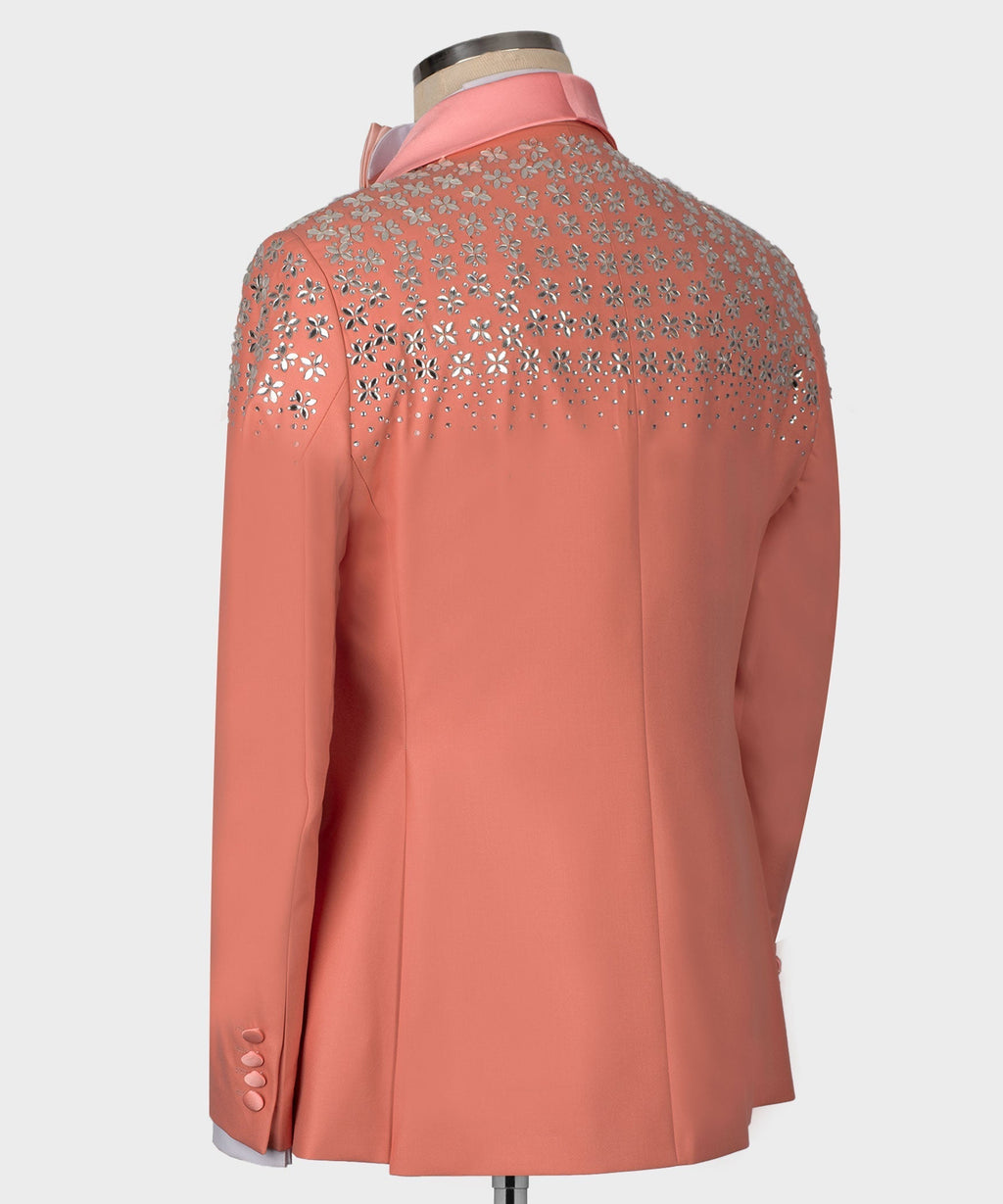 Dark pink tuxedo jacket back with rhinestone floral embellishment across shoulders