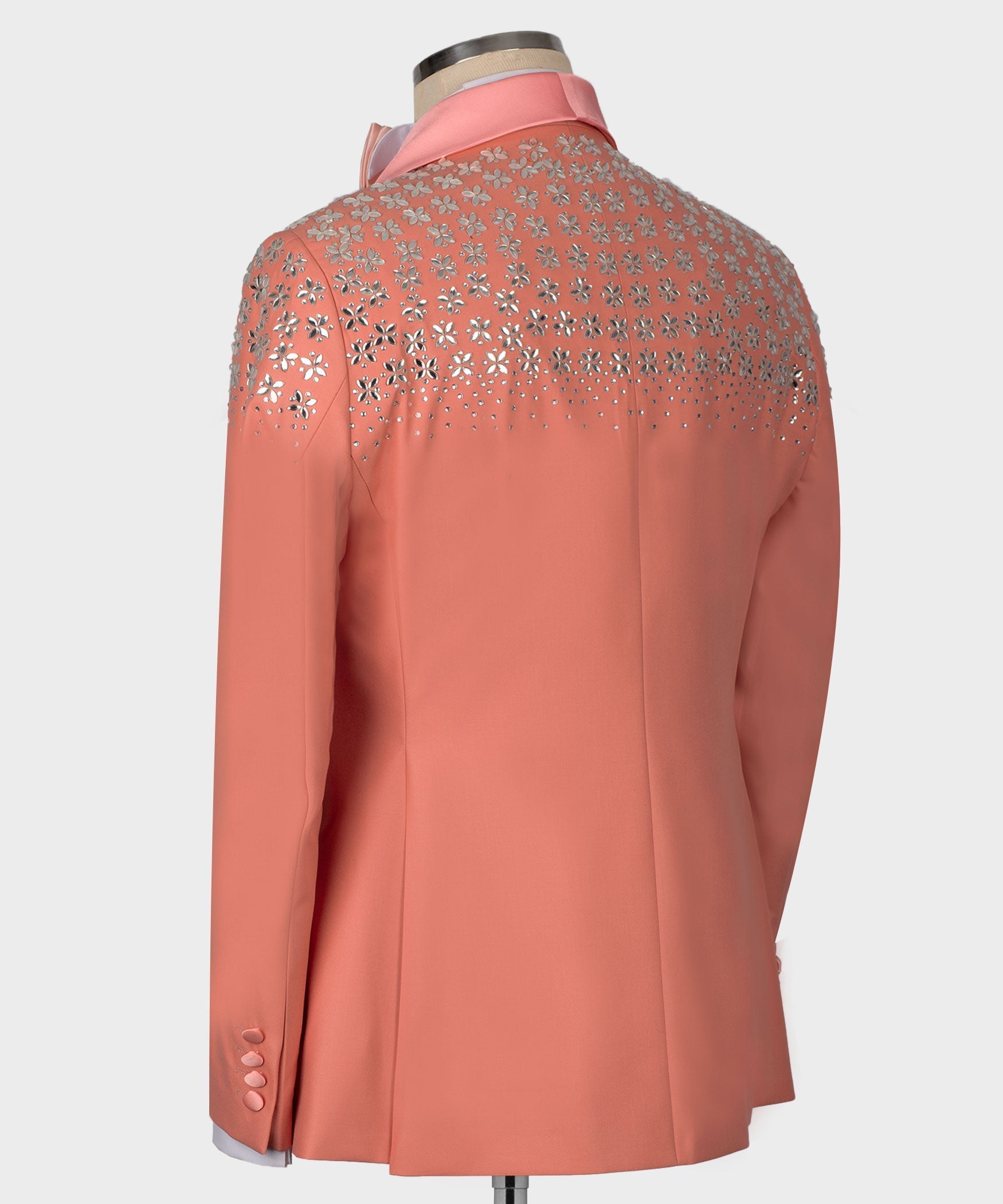 Dark pink tuxedo jacket back with rhinestone floral embellishment across shoulders