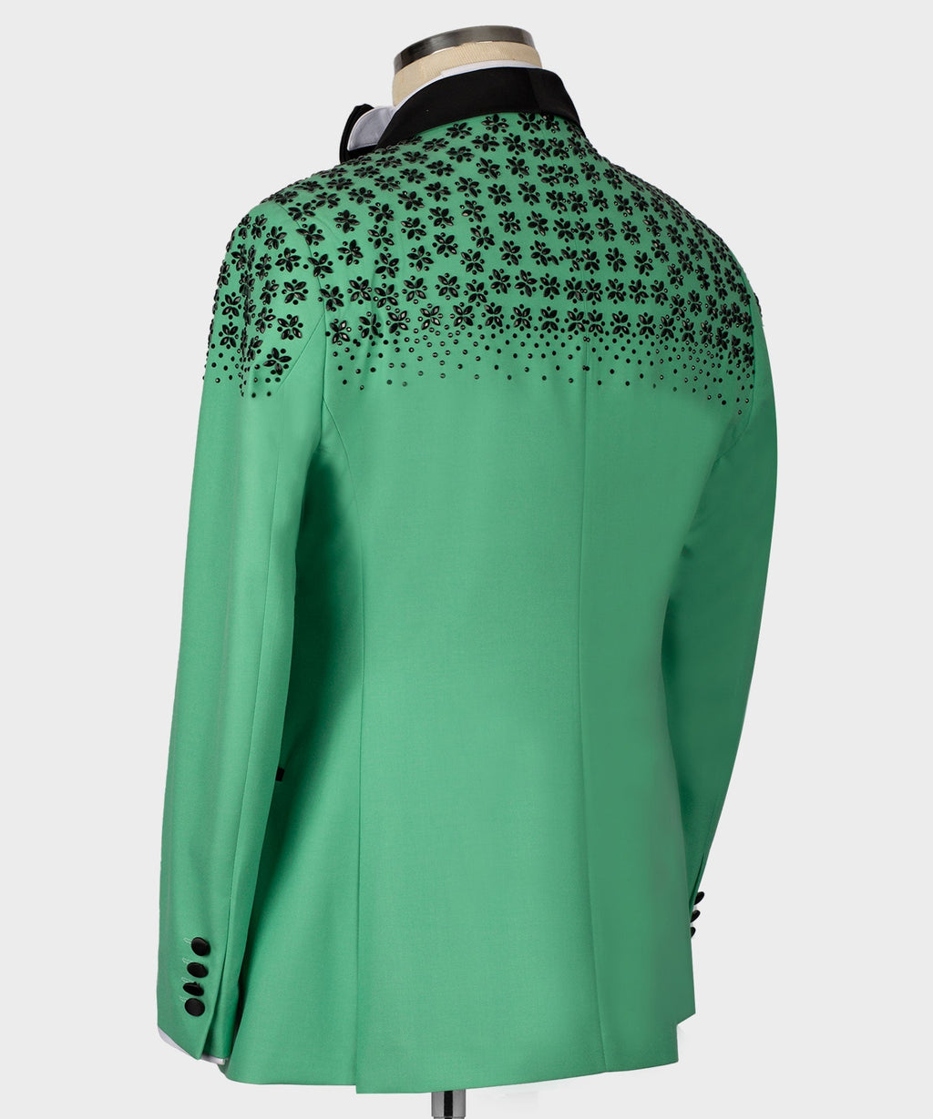 Light green tuxedo jacket back with black stone floral embroidery at shoulders and yoke.
