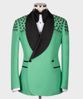 Light green silk tuxedo jacket with black shawl lapels, stone floral embroidery, bow tie.