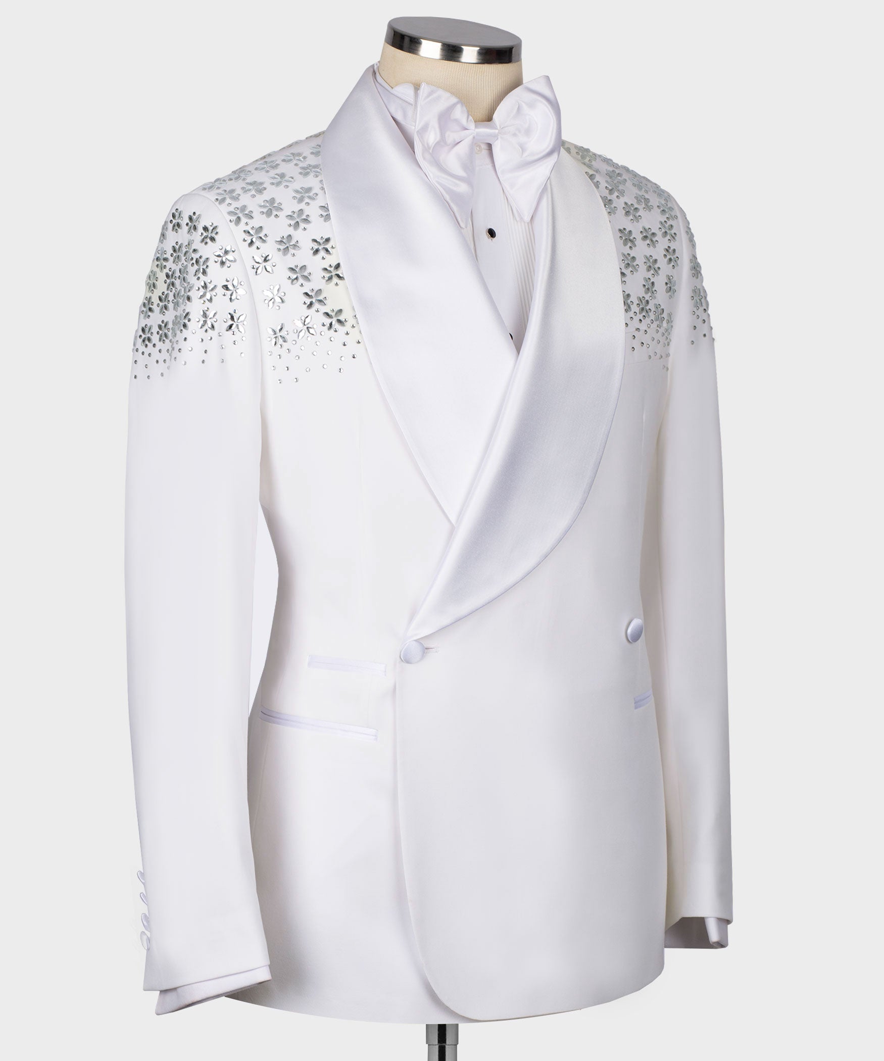 White tuxedo jacket with satin shawl lapel, front buttons, and rhinestone shoulder pattern