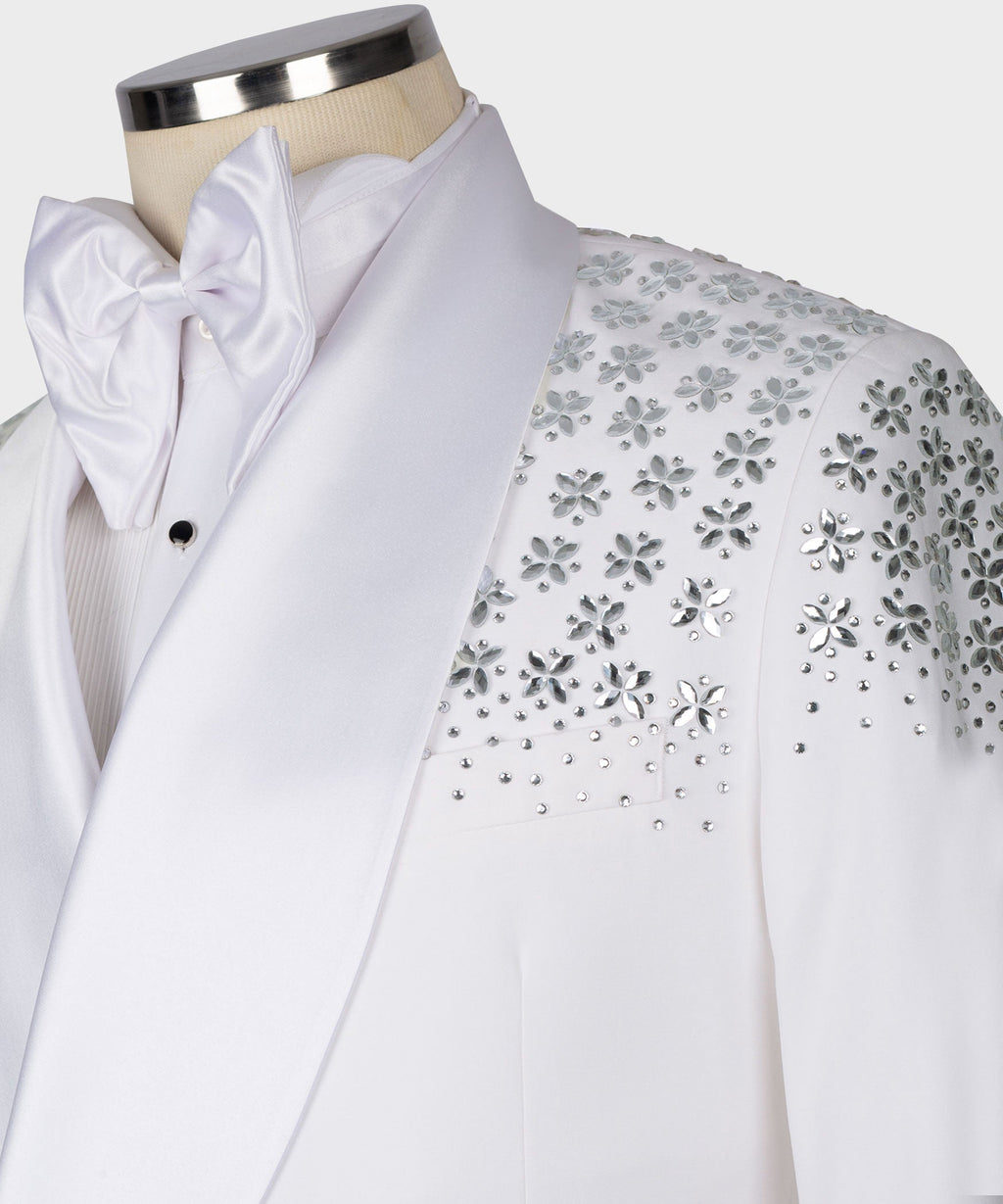 White tuxedo collar with oversized bow tie; rhinestone floral shoulder ornament detail