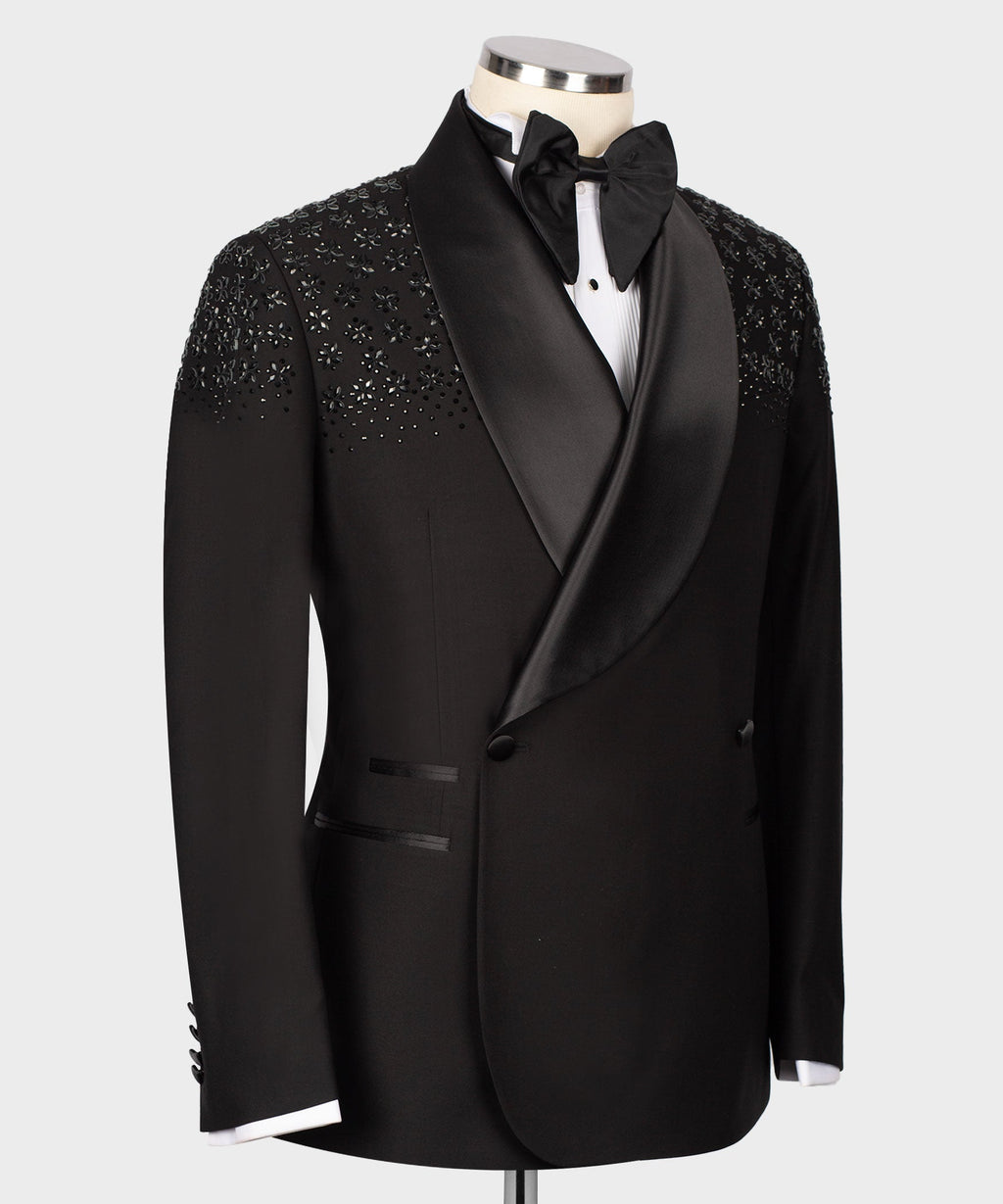 Black tuxedo jacket back with subtle stone embroidery across shoulders