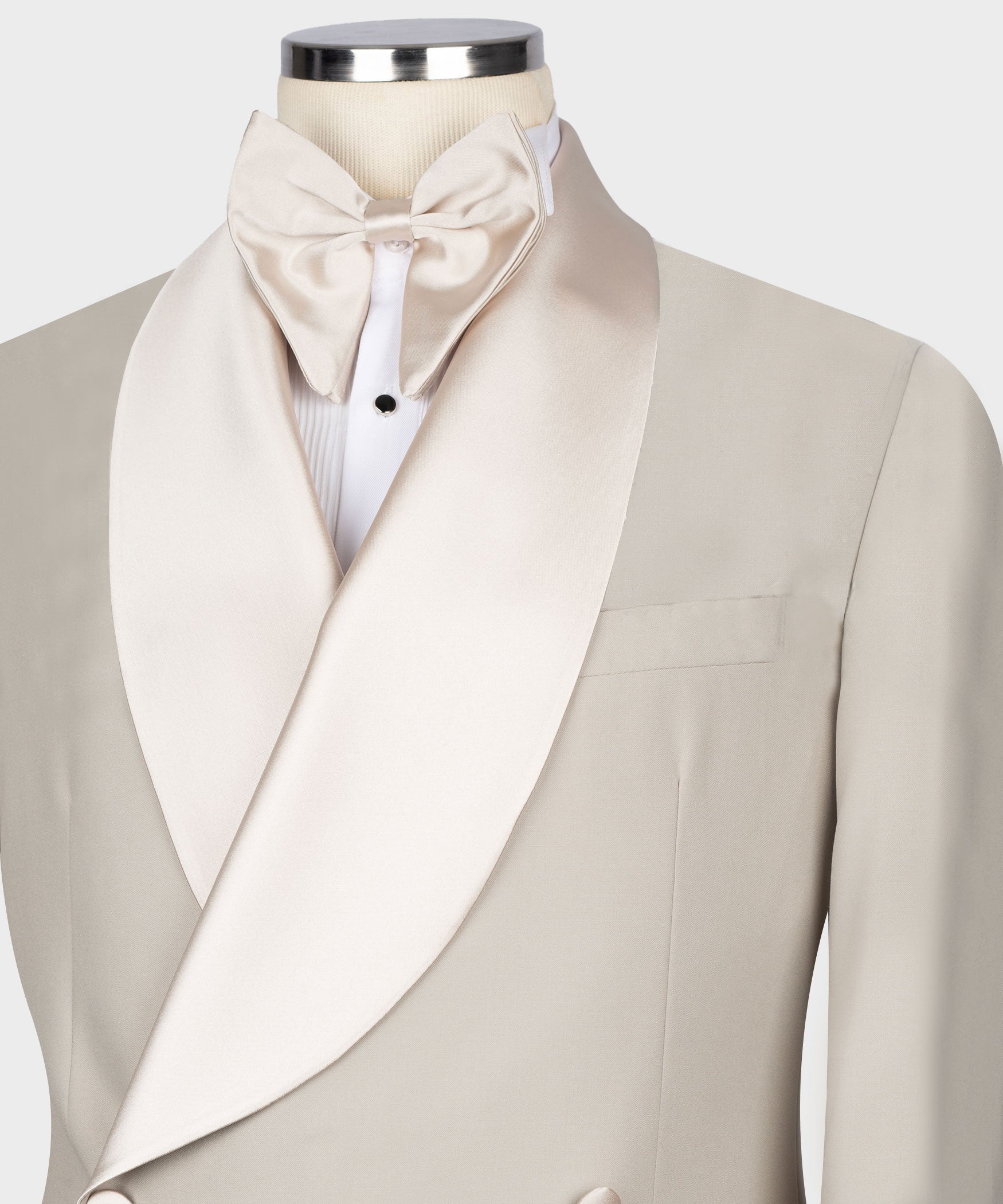 Beige tuxedo jacket close-up: satin bow tie and shawl collar lapel