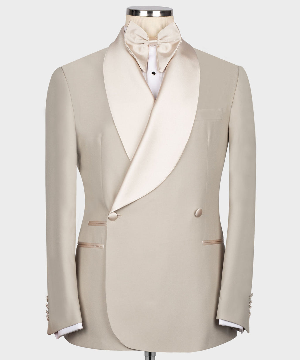 Beige tuxedo jacket with satin shawl collar, bow tie, and two-button front