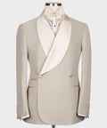 Beige tuxedo jacket with satin shawl collar, bow tie, and two-button front