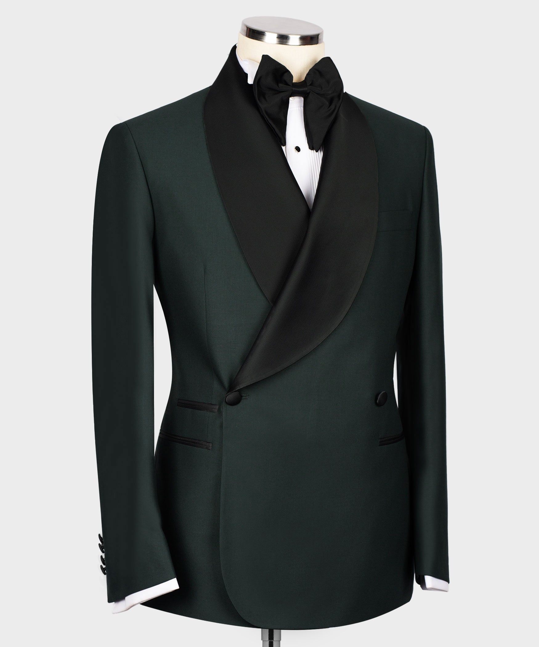 Green tuxedo jacket with black satin lapels and two-button closure, side view