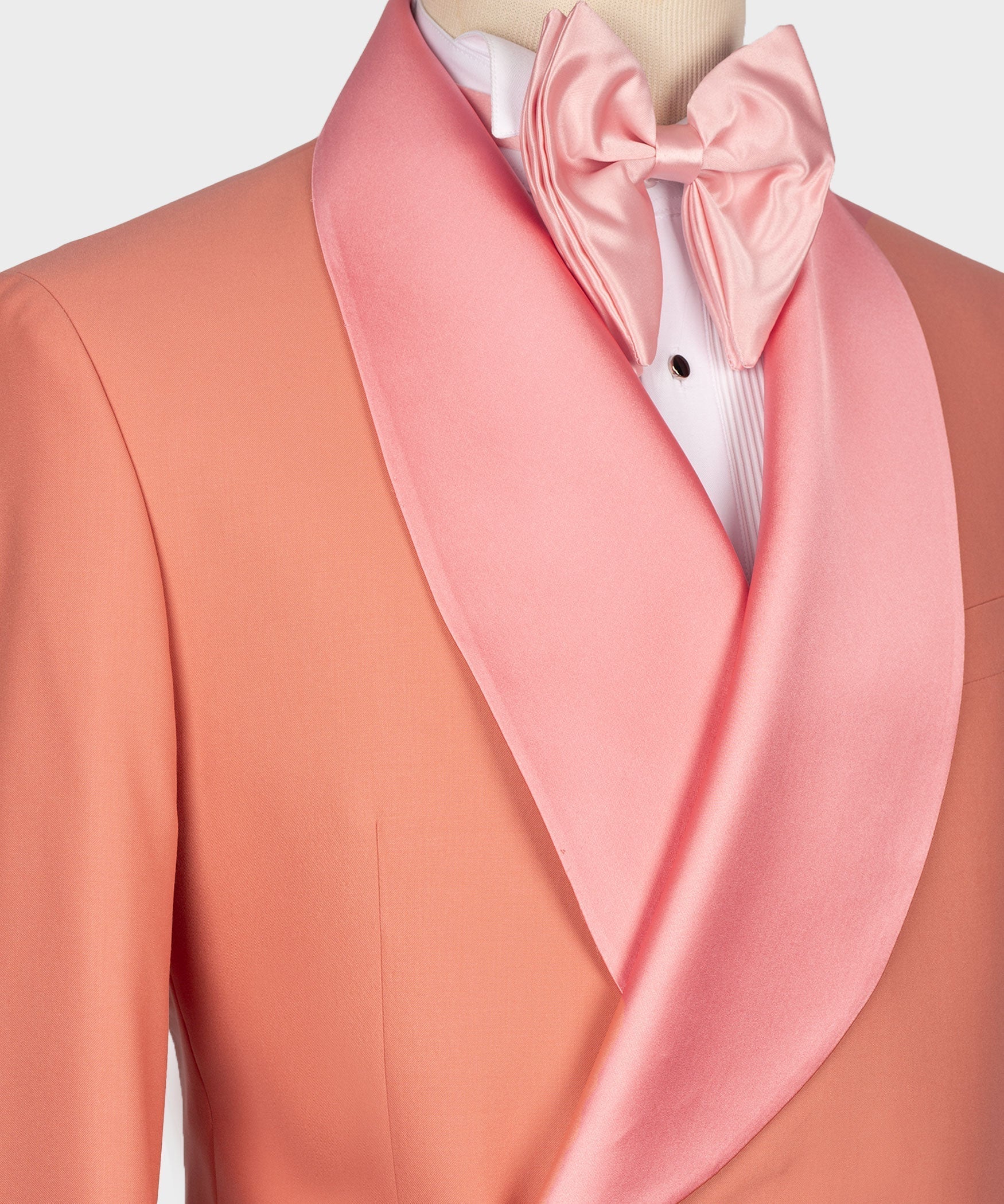 Satin pink bow tie and shawl collar on dark pink tuxedo jacket