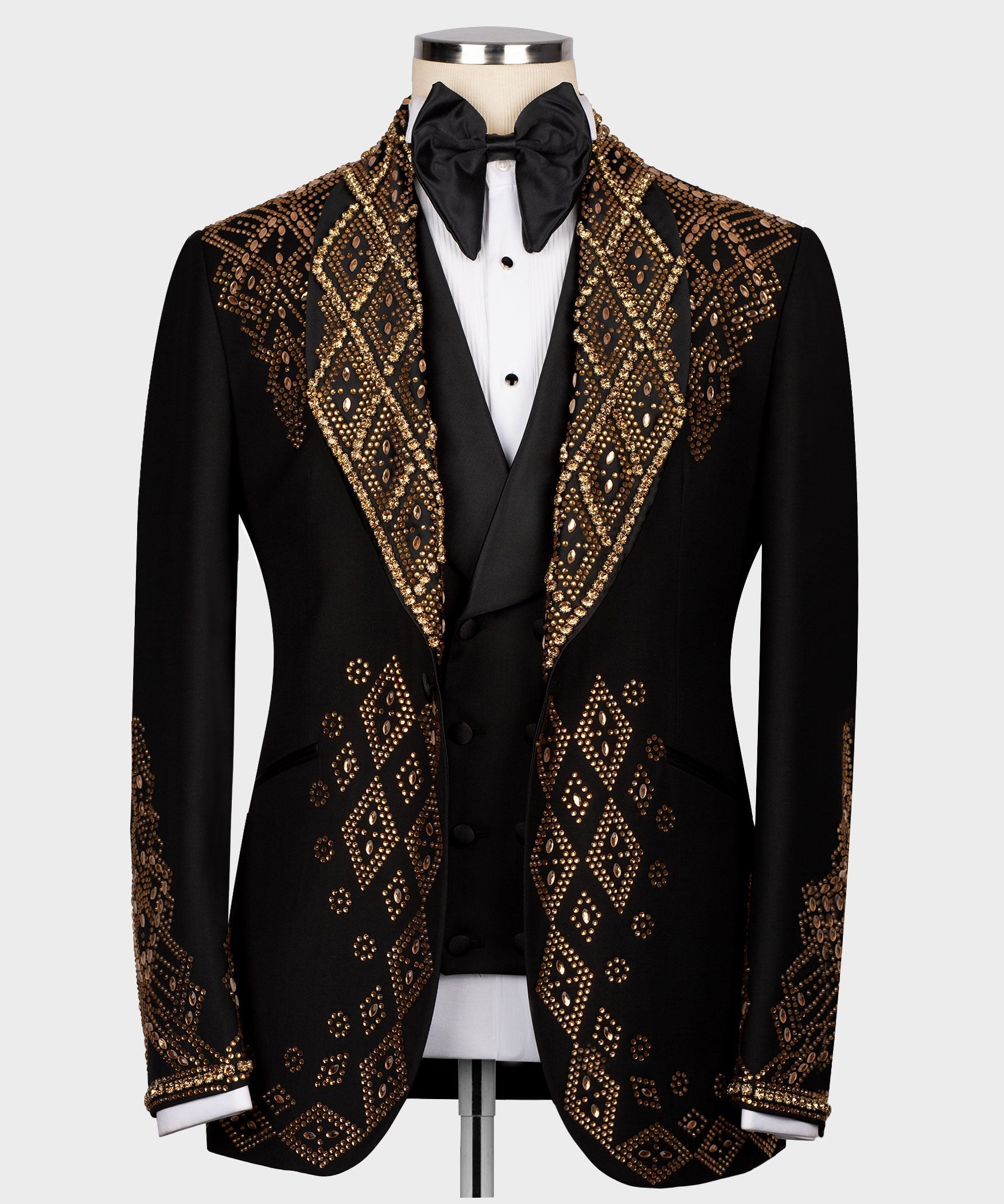 Black tuxedo jacket with gold stone embroidery, satin lapels and bow tie